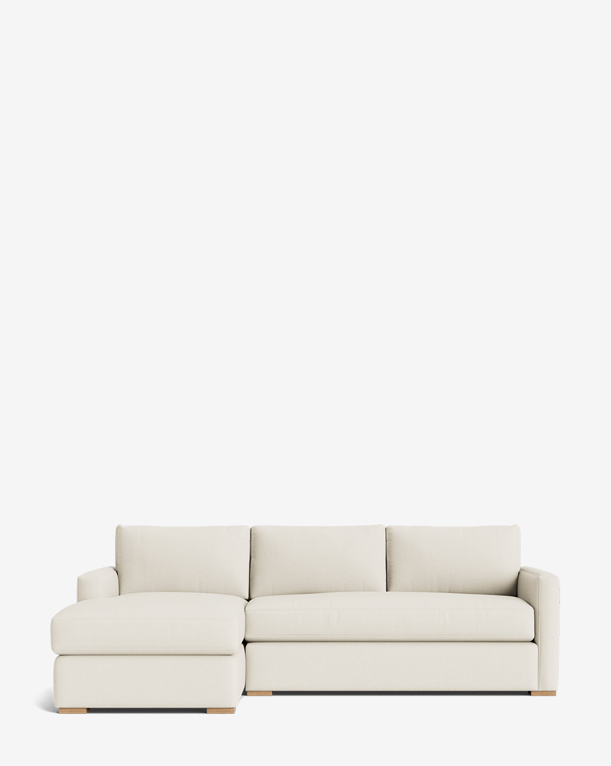 The Macy Upholstered Chaise Sectional 101 features a modern, light beige design with a left-side lounge, low wooden block legs, and clean lines to bring refined comfort to any living room, by McGee & Co.