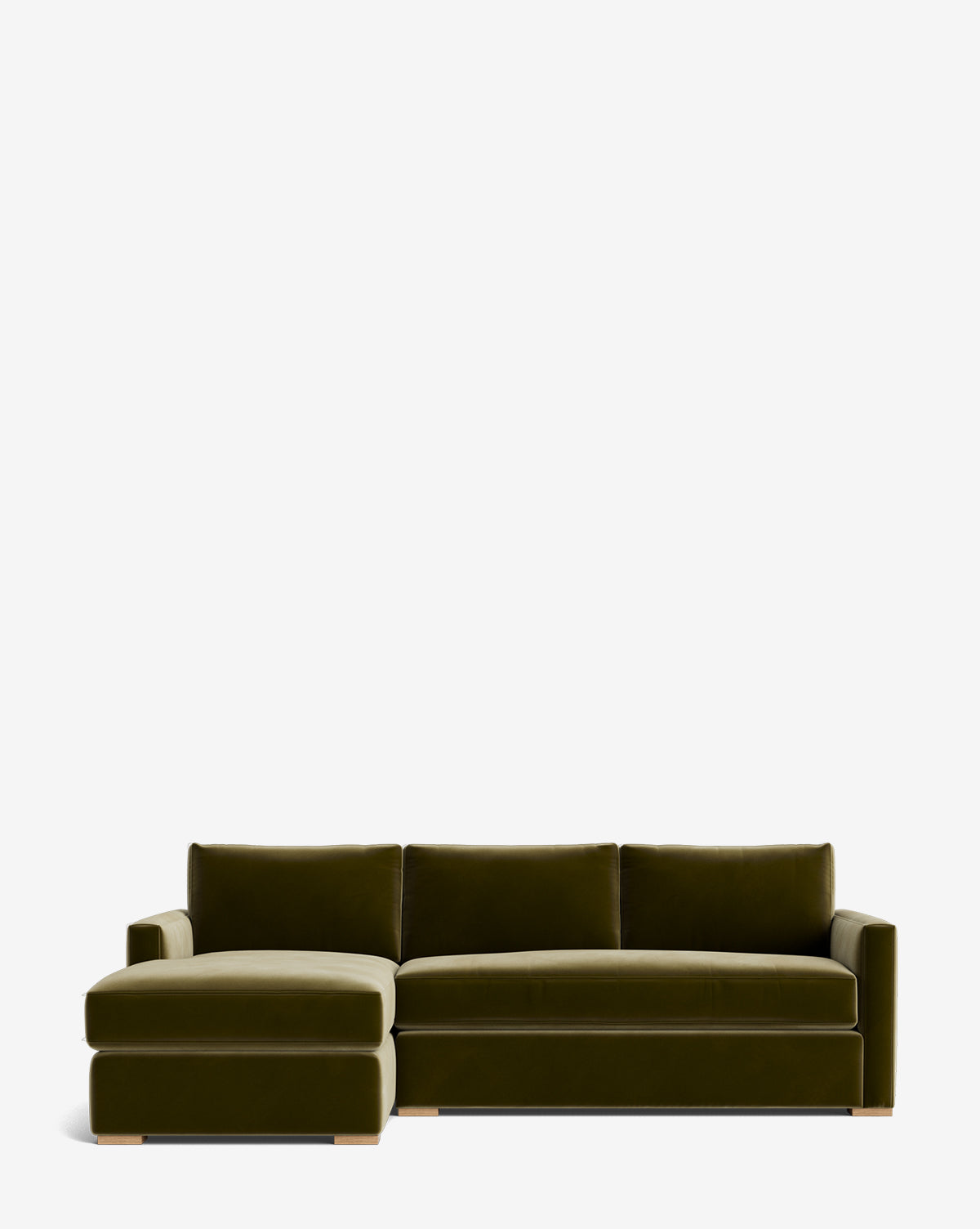 The Community Macy Upholstered Chaise Sectional 101 is a modern, dark green velvet luxury sofa with three back cushions and a left-facing chaise, shown against a plain white background. McGee & Co.