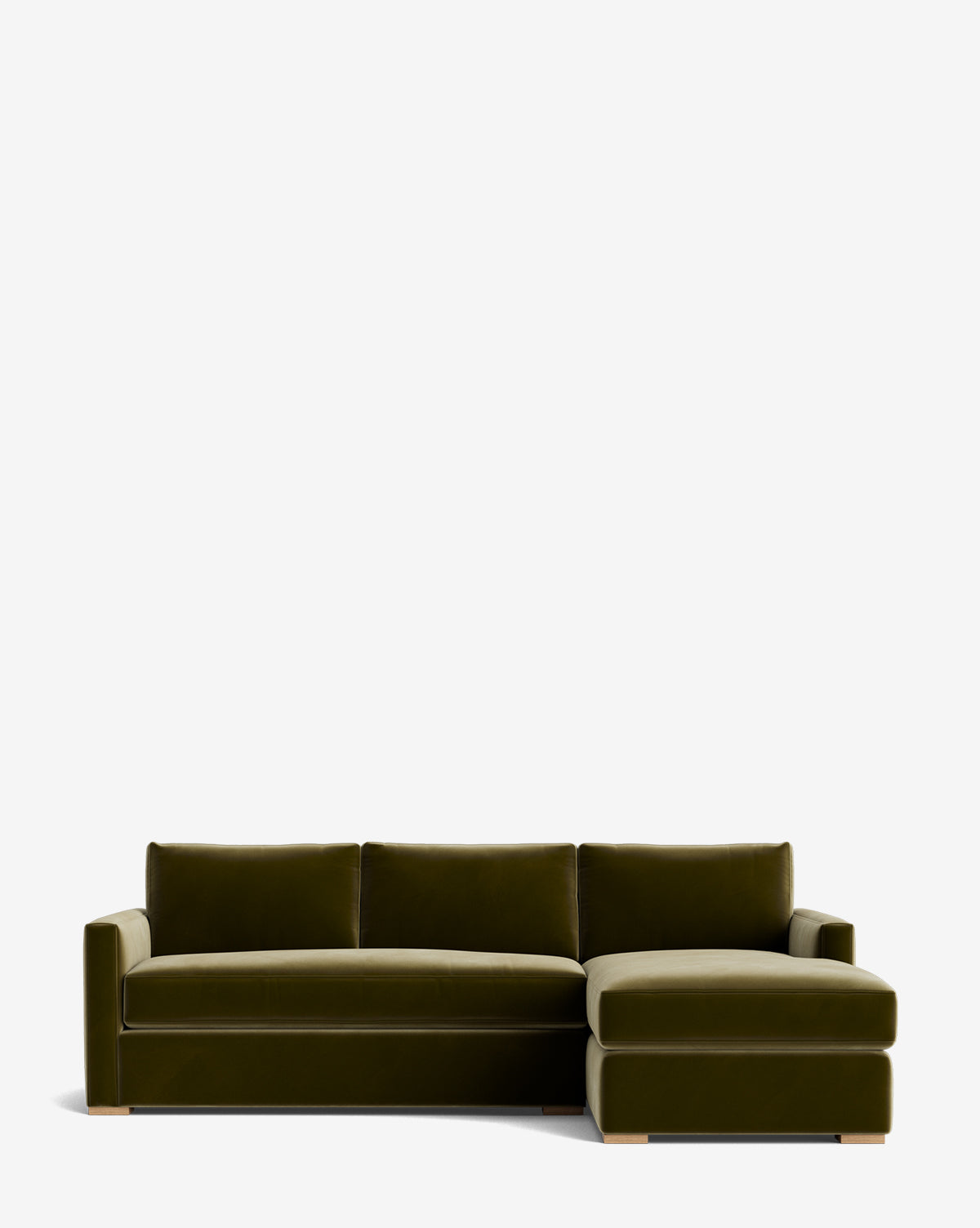 The Macy Upholstered Chaise Sectional 101 is a modern olive green velvet sofa with clean lines, firm cushions, a right-facing upholstered chaise lounge, and low wooden block feet, set against a plain white background by McGee & Co.