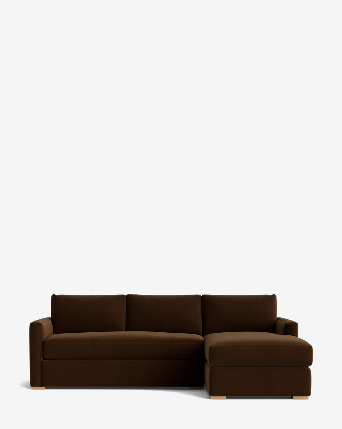 The Macy Upholstered Chaise Sectional 101 is a dark brown, L-shaped sofa with a right-facing chaise, clean lines, plush cushions, and low wooden feet—ideal for adding stylish comfort to your living room, by McGee & Co.