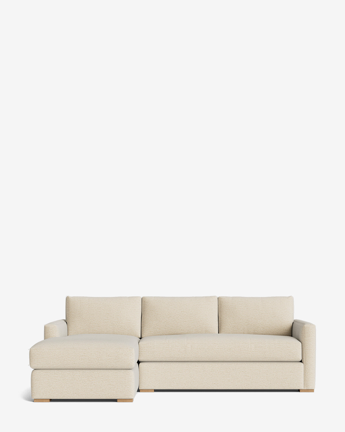 The Macy Upholstered Chaise Sectional 101 by Community features a beige finish, left-side upholstered chaise lounge, three back cushions, and low wooden block legs, shown against a plain white background. McGee & Co.