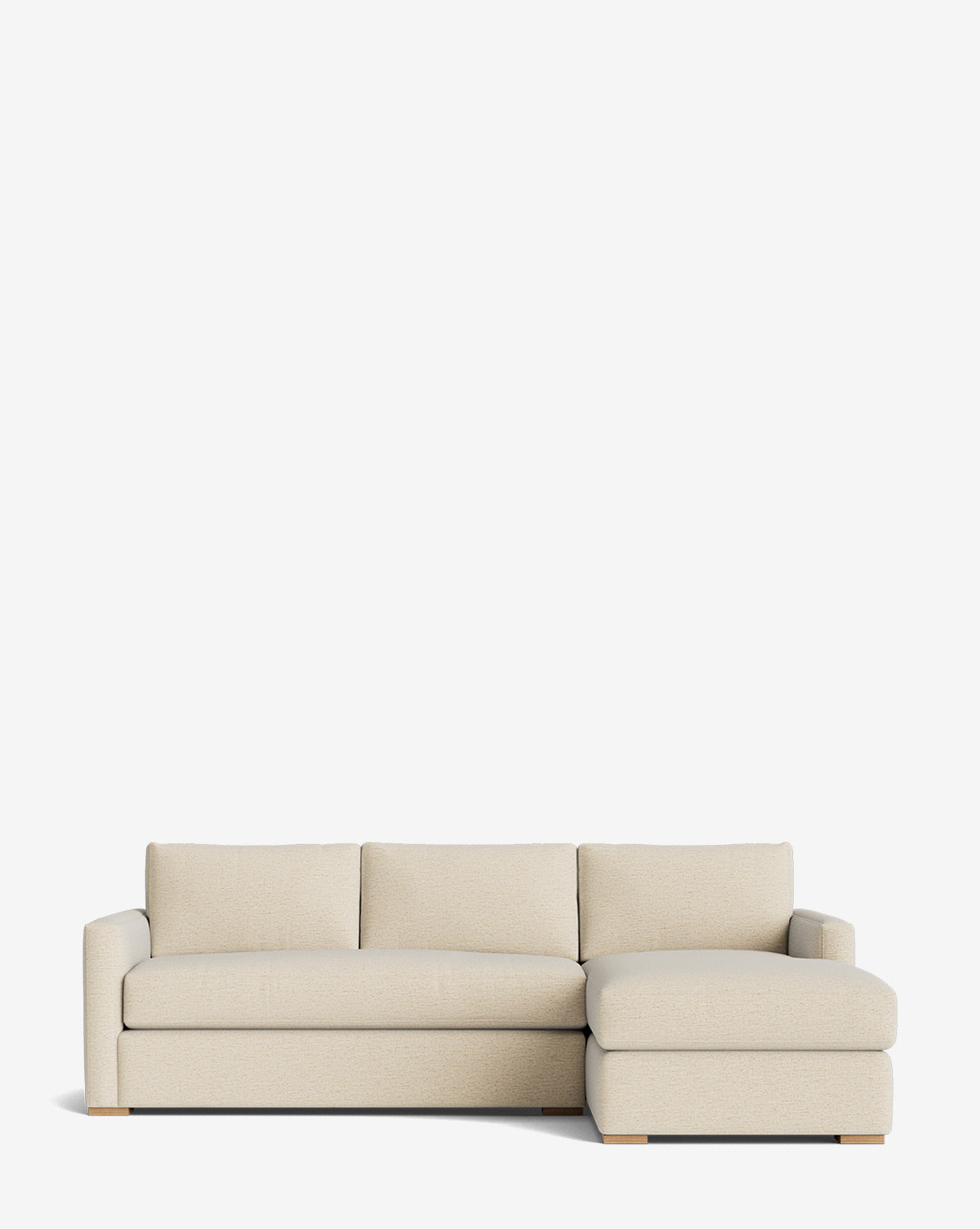 The Macy Upholstered Chaise Sectional 101 is a beige, modern sofa with three cushions and a right-side chaise, featuring low wooden legs and a minimalist look, shown against a plain white background by McGee & Co.