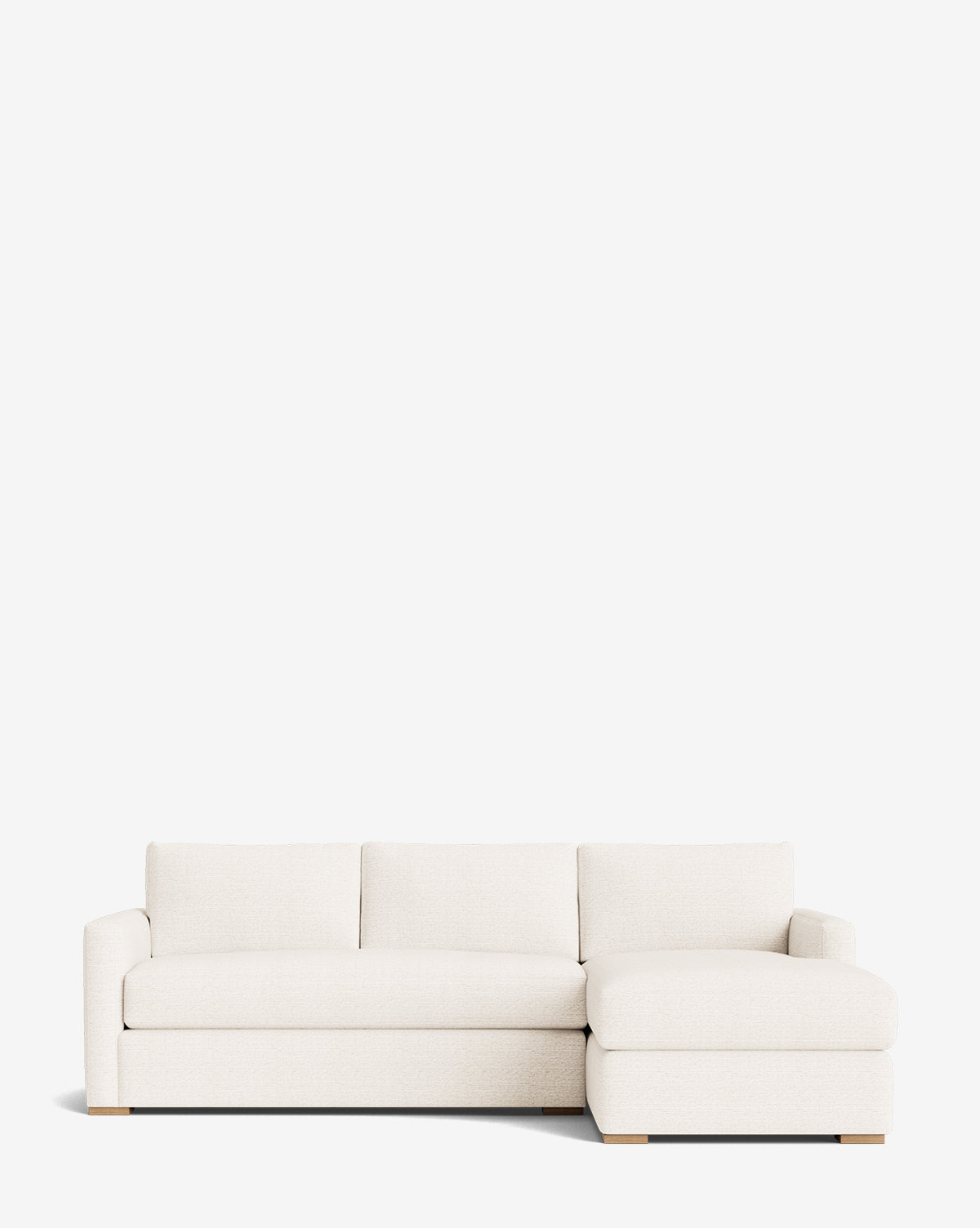 The Macy Upholstered Chaise Sectional 101 is a modern, off-white customizable sofa featuring three seat cushions and a right-facing upholstered chaise, shown against a plain white background by McGee & Co.