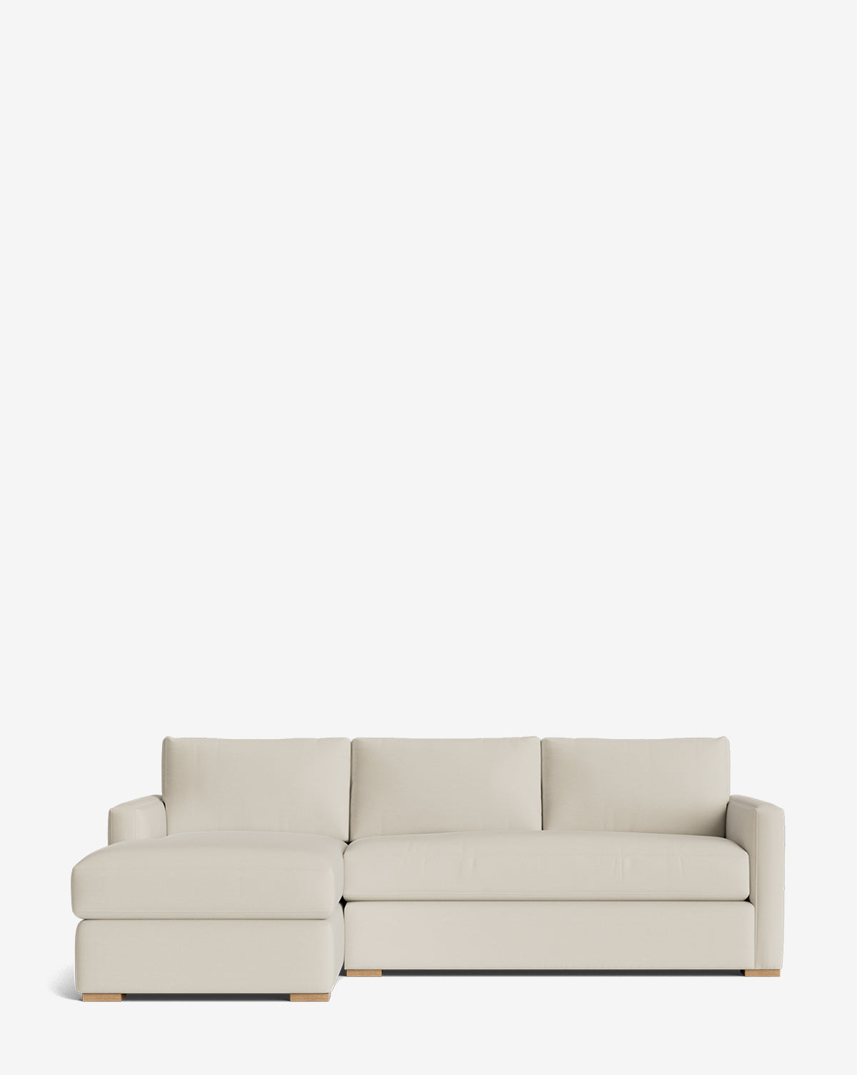 The Macy Upholstered Chaise Sectional 101 features a light beige, customizable design with a left-side chaise, plush cushions, low wooden legs, and minimalist style set against a plain white background by McGee & Co.