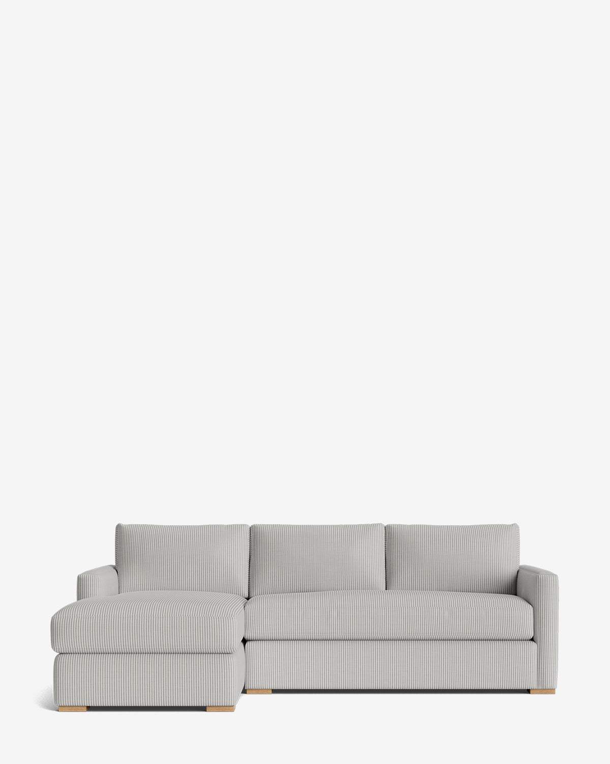 The Macy Upholstered Chaise Sectional 101 features light gray ribbed fabric, wooden block feet, and a left-facing chaise lounge—ideal for your living room, by McGee & Co. Shown here against a plain white background.