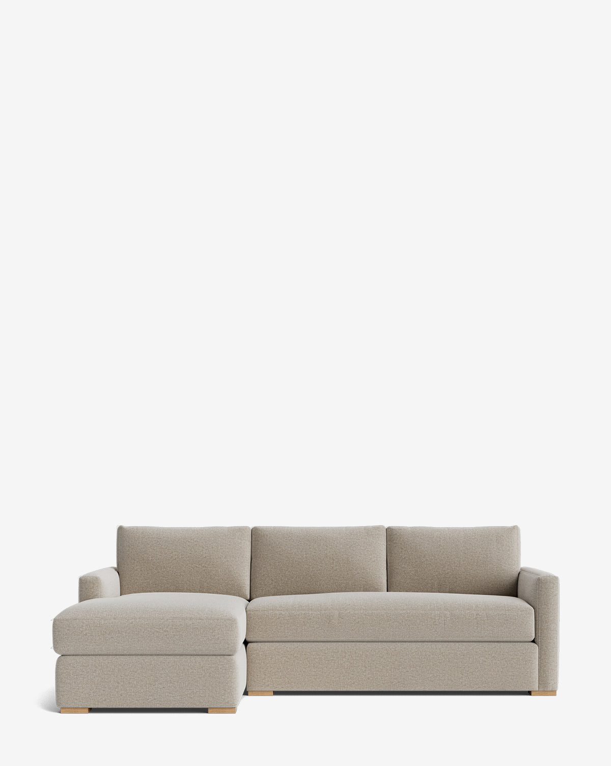 The Community Macy Upholstered Chaise Sectional 101 features a modern design with light gray fabric, clean lines, wooden block feet, three back cushions, a low profile, and a left-facing chaise lounge by McGee & Co.