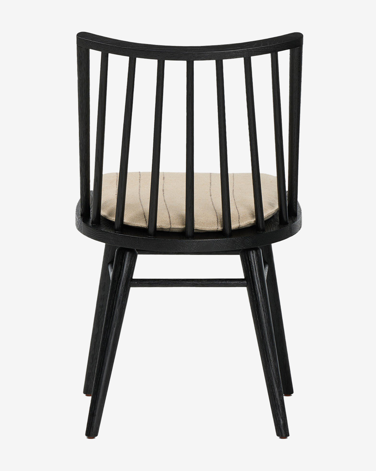The Madison Dining Chair features a black frame, vertical slats on the backrest, and a beige cushioned seat, by McGee & Co. Shown from behind against a white background.