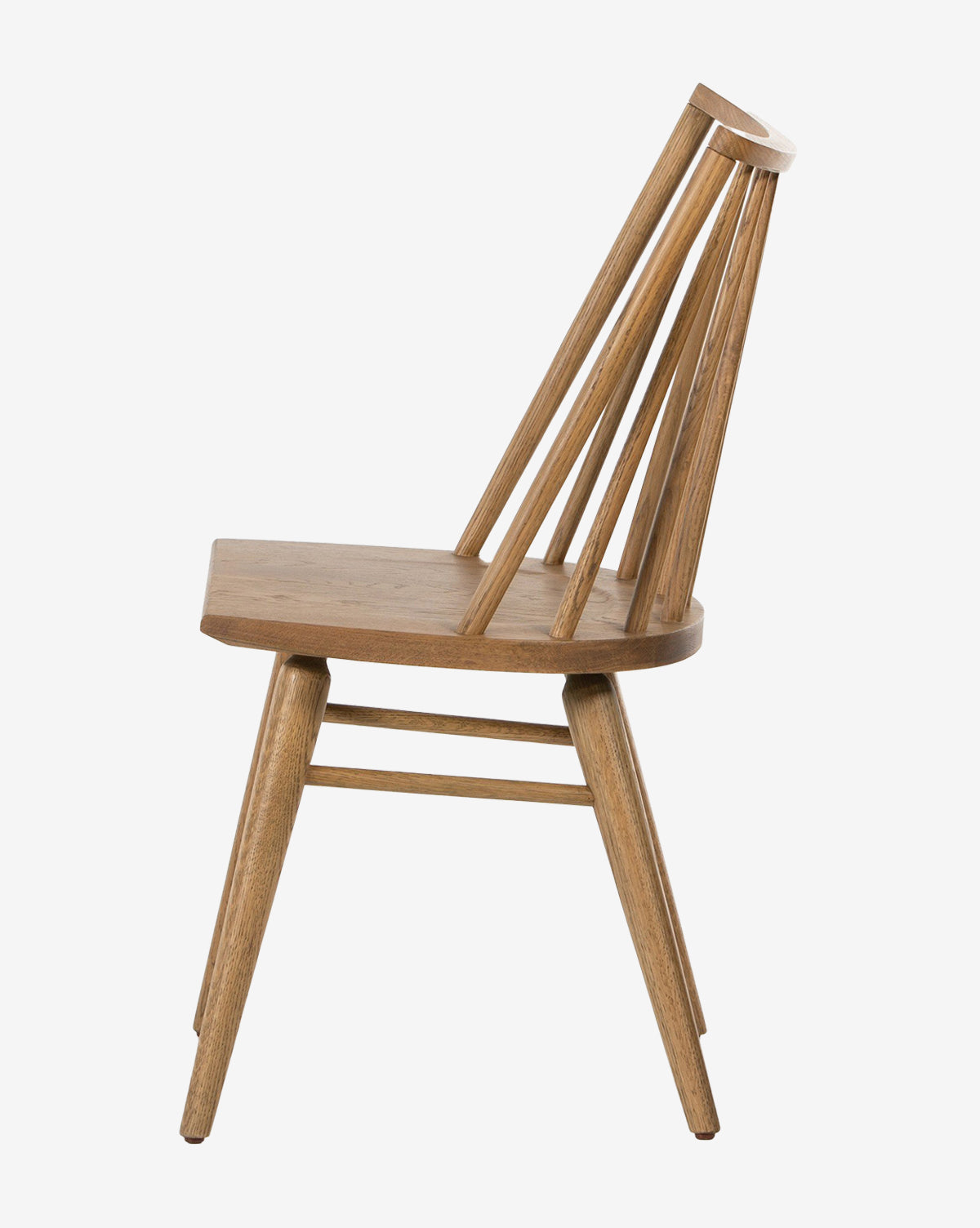 The Madison Dining Chair features angled legs, a flat seat, and a slanted backrest with several vertical wooden rods, shown from the side against a white background by McGee & Co.