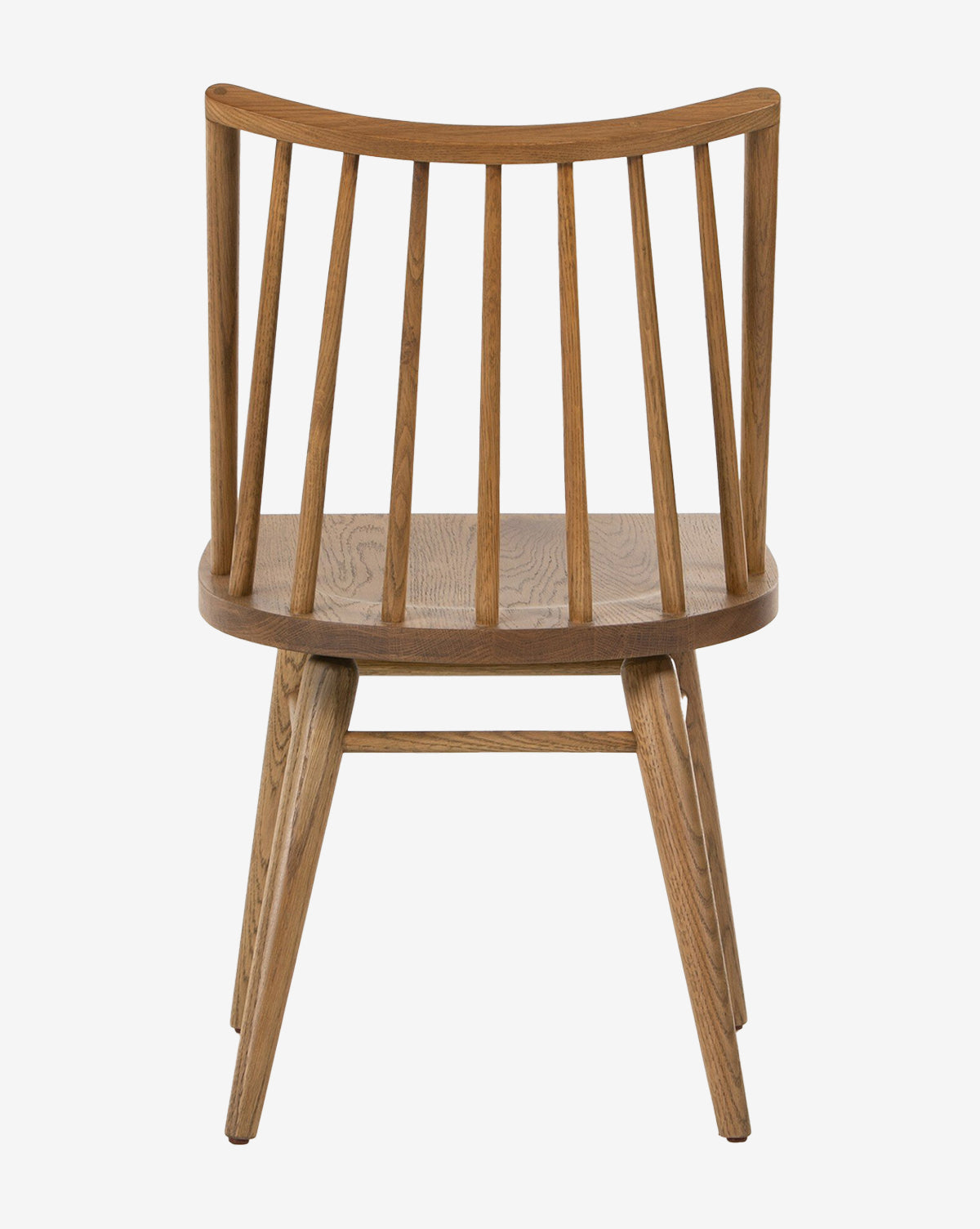The Madison Dining Chair is a contemporary Windsor-style seat with a rounded back, evenly spaced vertical slats, angled legs, and a smooth flat seat. Its simple modern design highlights the beauty of natural wood grain by McGee & Co.