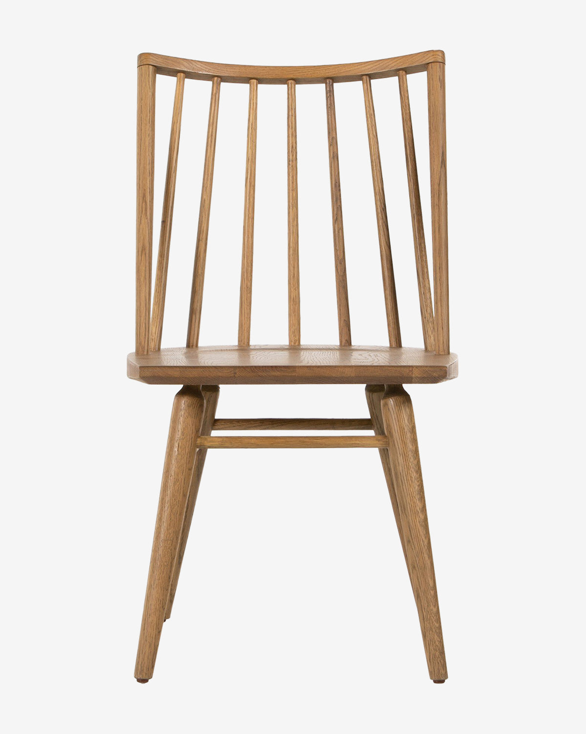 The Madison Dining Chair is a contemporary Windsor-style seat made of oak, with a slightly curved backrest, vertical slats, and angled legs, shown from the front against a white background, by McGee & Co.