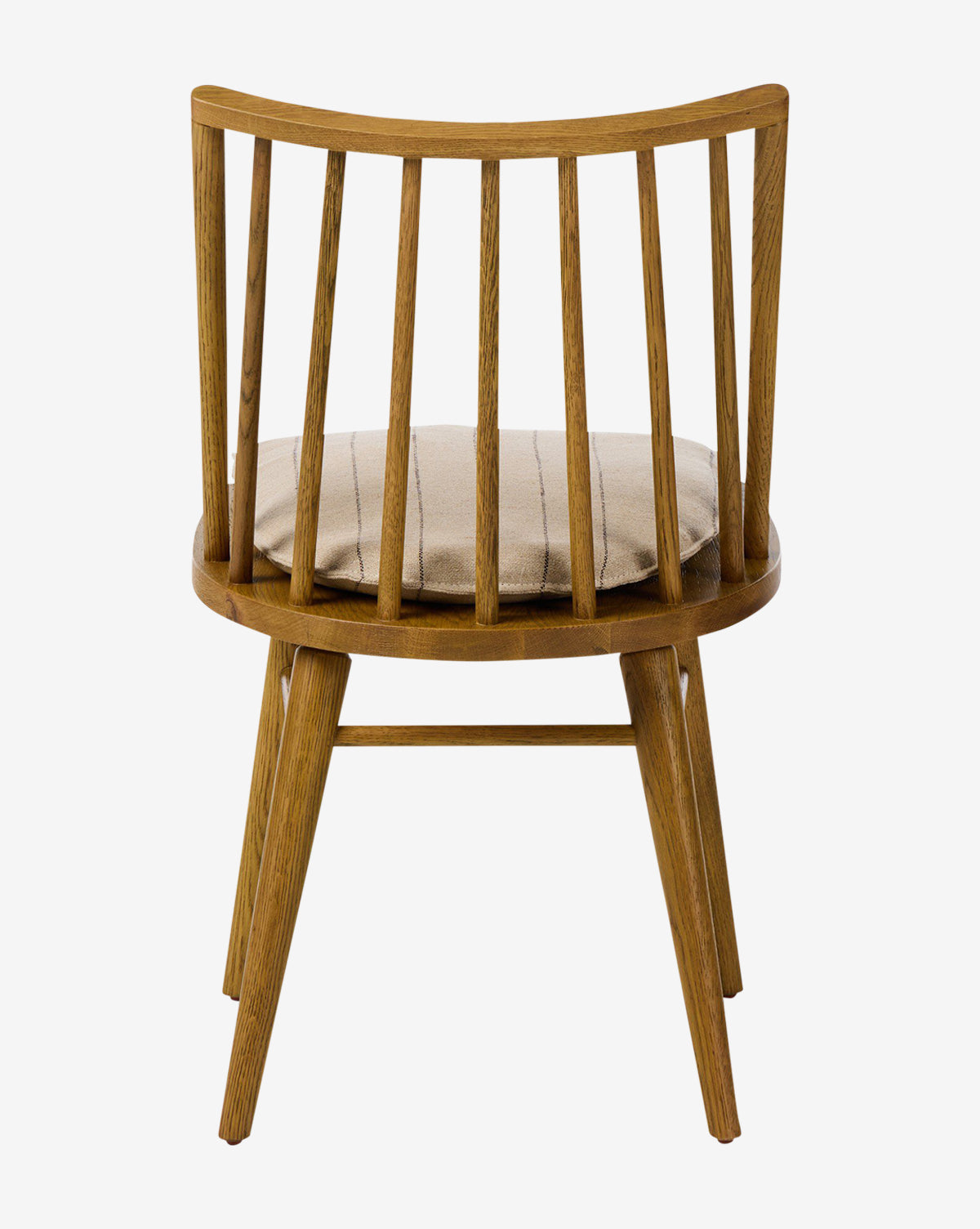 The Madison Dining Chair features a curved, slatted backrest, four angled legs, and a light-colored cushioned seat. Crafted from oak, this elegant chair is shown against a plain white background by McGee & Co.