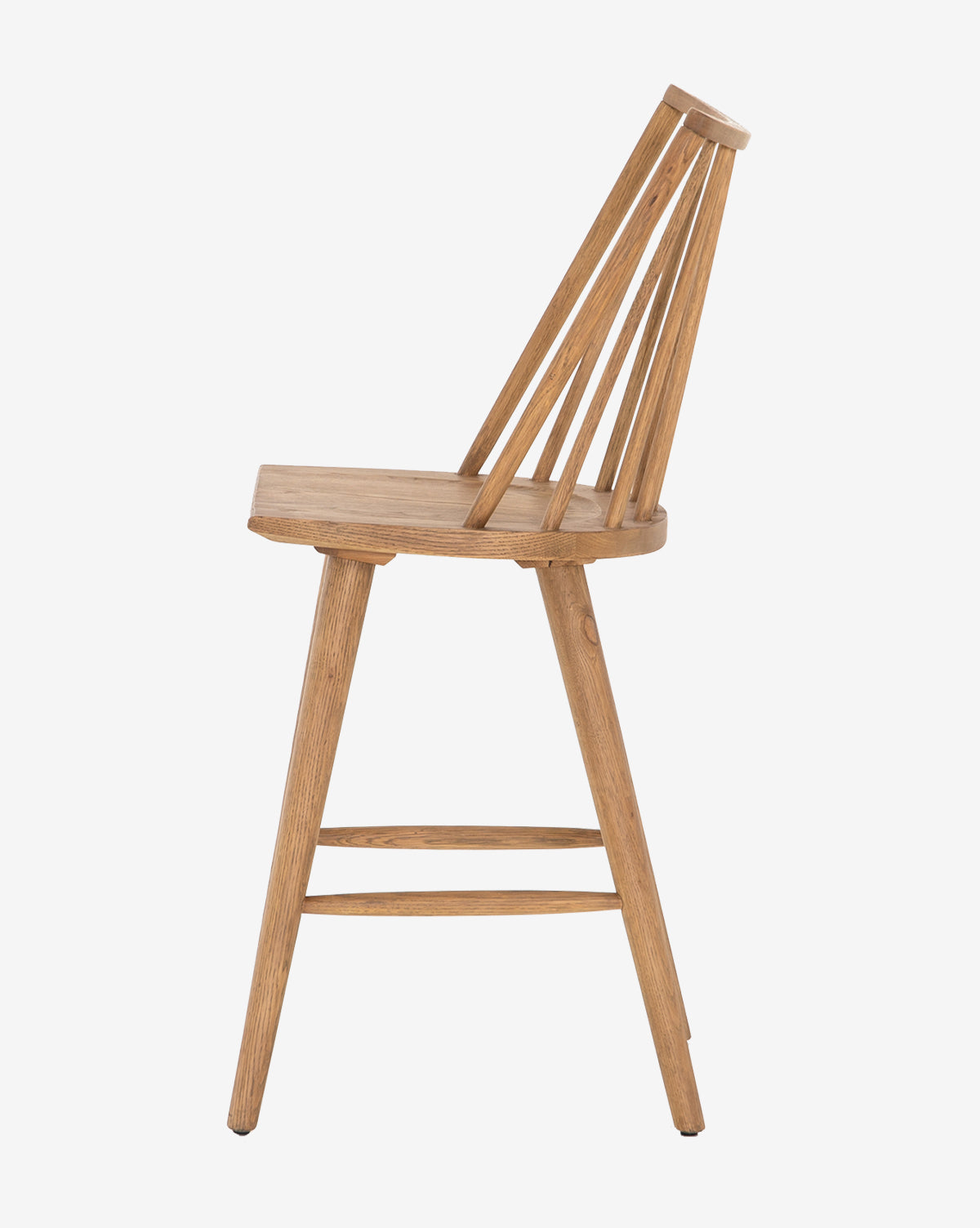 The Madison Stool is inspired by the classic Windsor design, featuring a slanted backrest with four vertical slats and angled legs, shown from the side against a plain white background.