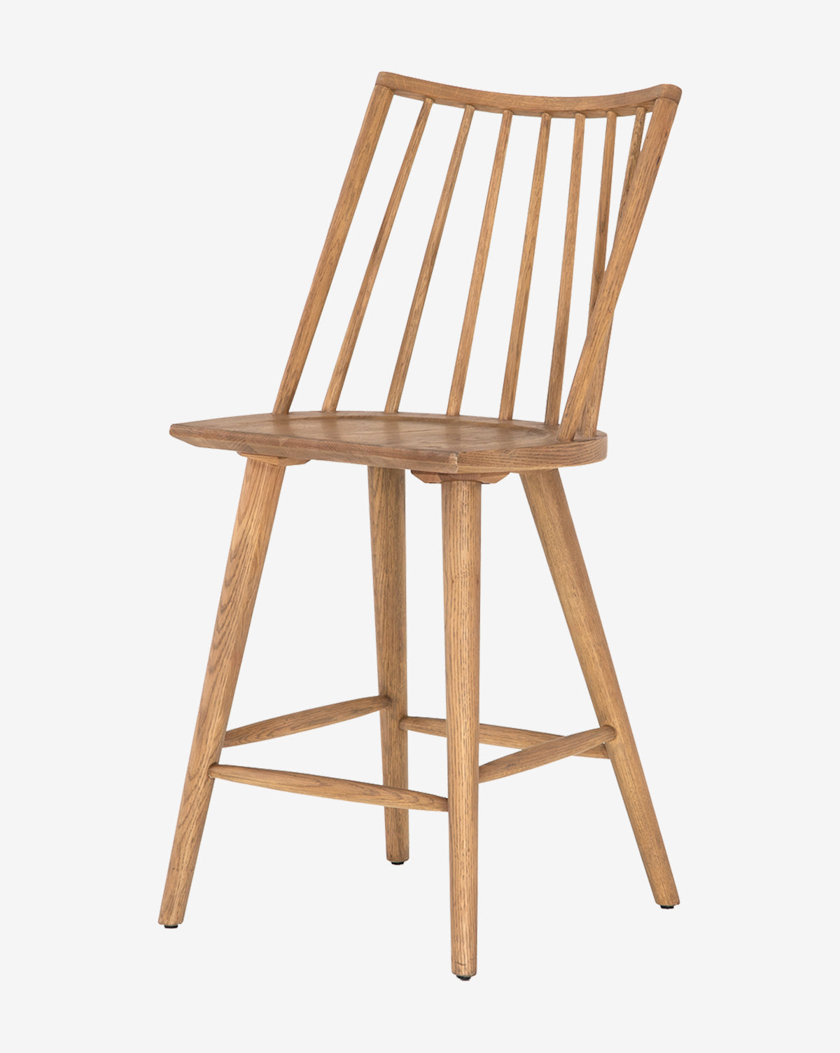 The Madison Stool features a spindle backrest, slightly angled legs, and a natural wood finish, displayed against a plain white background.