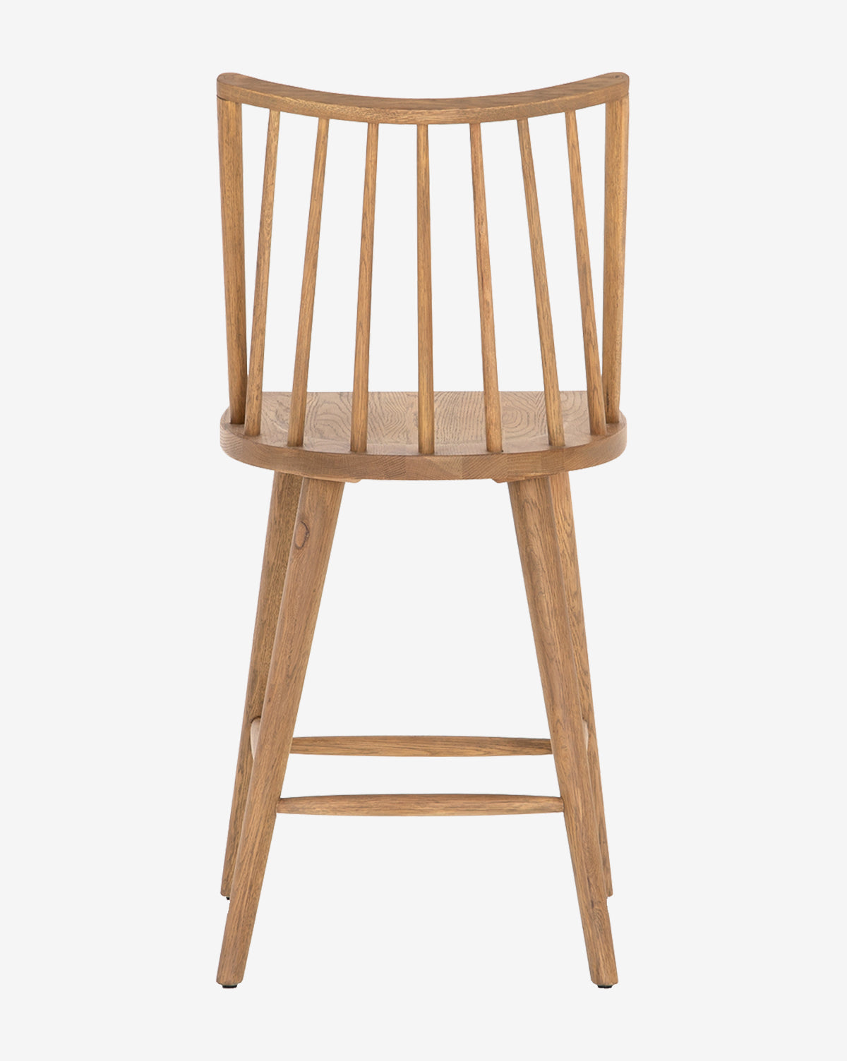 The Madison Stool is a wooden chair inspired by Windsor stools, featuring a rounded backrest with vertical slats, four angled legs, and a natural finish. Shown from the back against a plain white background.