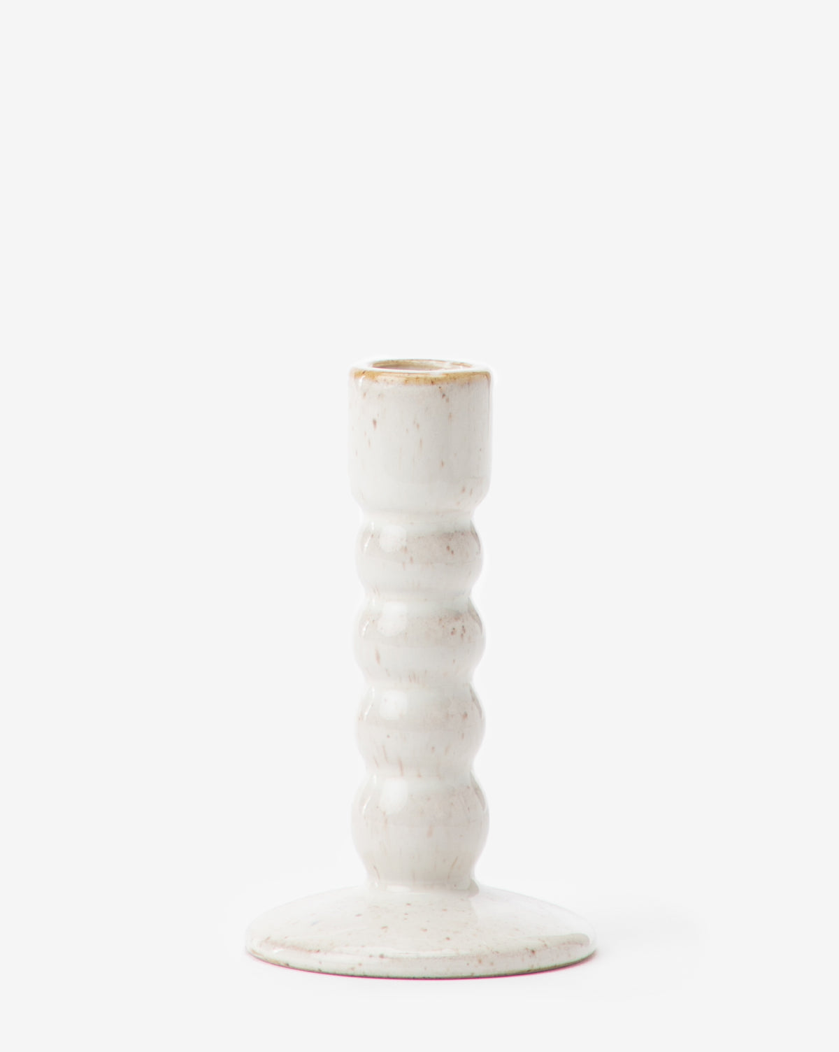 The Mae Ceramic Taper Holder features a glossy white stoneware finish, ribbed wavy stem, and round base, set against a plain white background.