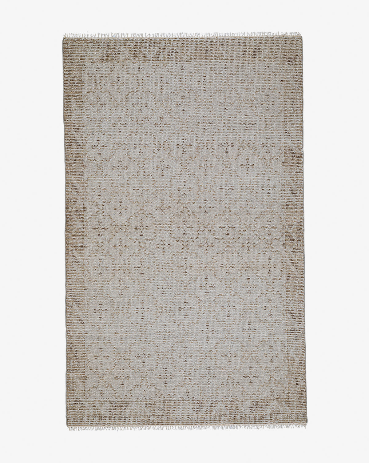 The Mali Hand-Knotted Rug is rectangular and beige, featuring a textured woven look with a subtle floral pattern, light brown border, and short fringe on the ends, by McGee & Co.
