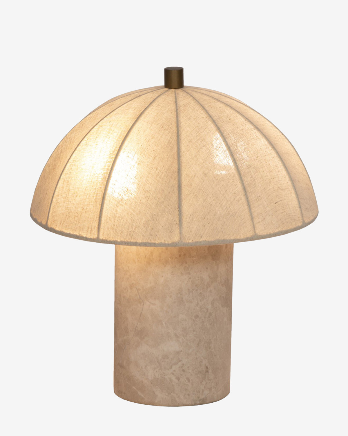 The Malinska Table Lamp features a wide linen dome shade and a cylindrical beige base, softly glowing against a plain white background, by McGee & Co.