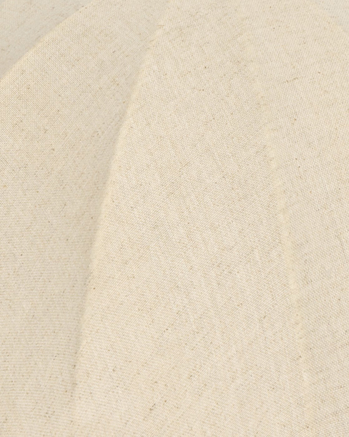 A close-up of the Malinska Table Lamp’s linen dome shade shows beige woven fabric with visible stitching and diagonal seams, creating elegant panels and a smooth textured surface to complement its Italian marble base, by McGee & Co.