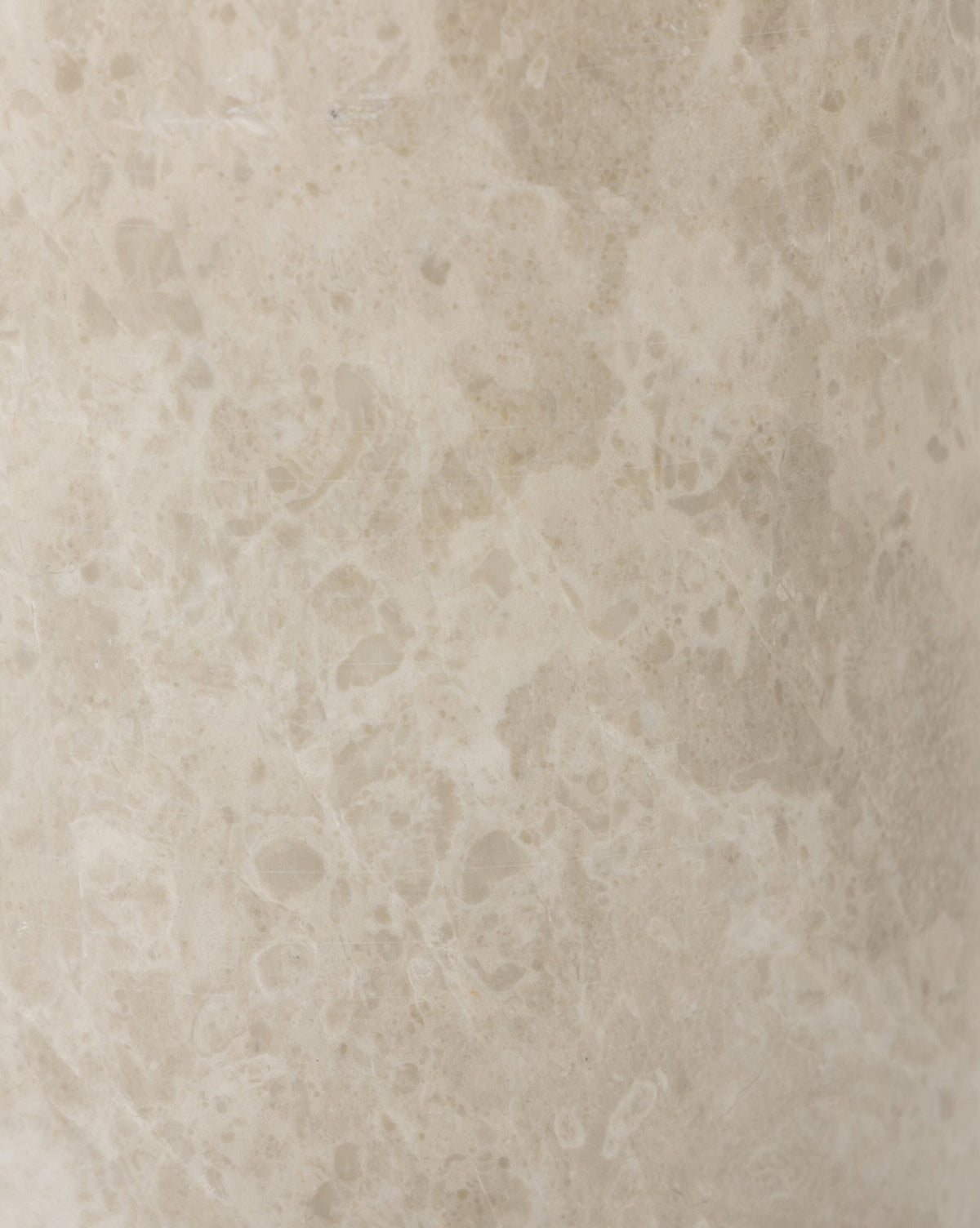 Close-up of a light beige marble surface, like that on the Malinska Table Lamp, with a natural, smooth texture featuring subtle color and pattern variations, including small speckles and veins, by McGee & Co.