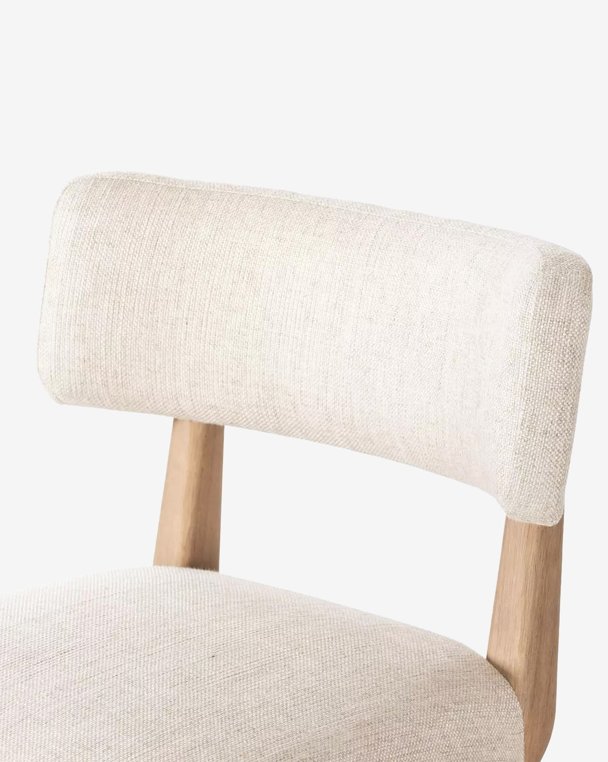 A close-up of the Mance Swivel Stool by Four Hands, featuring a light beige upholstered seat and backrest with wooden supports, set against a plain white background, McGee & Co.