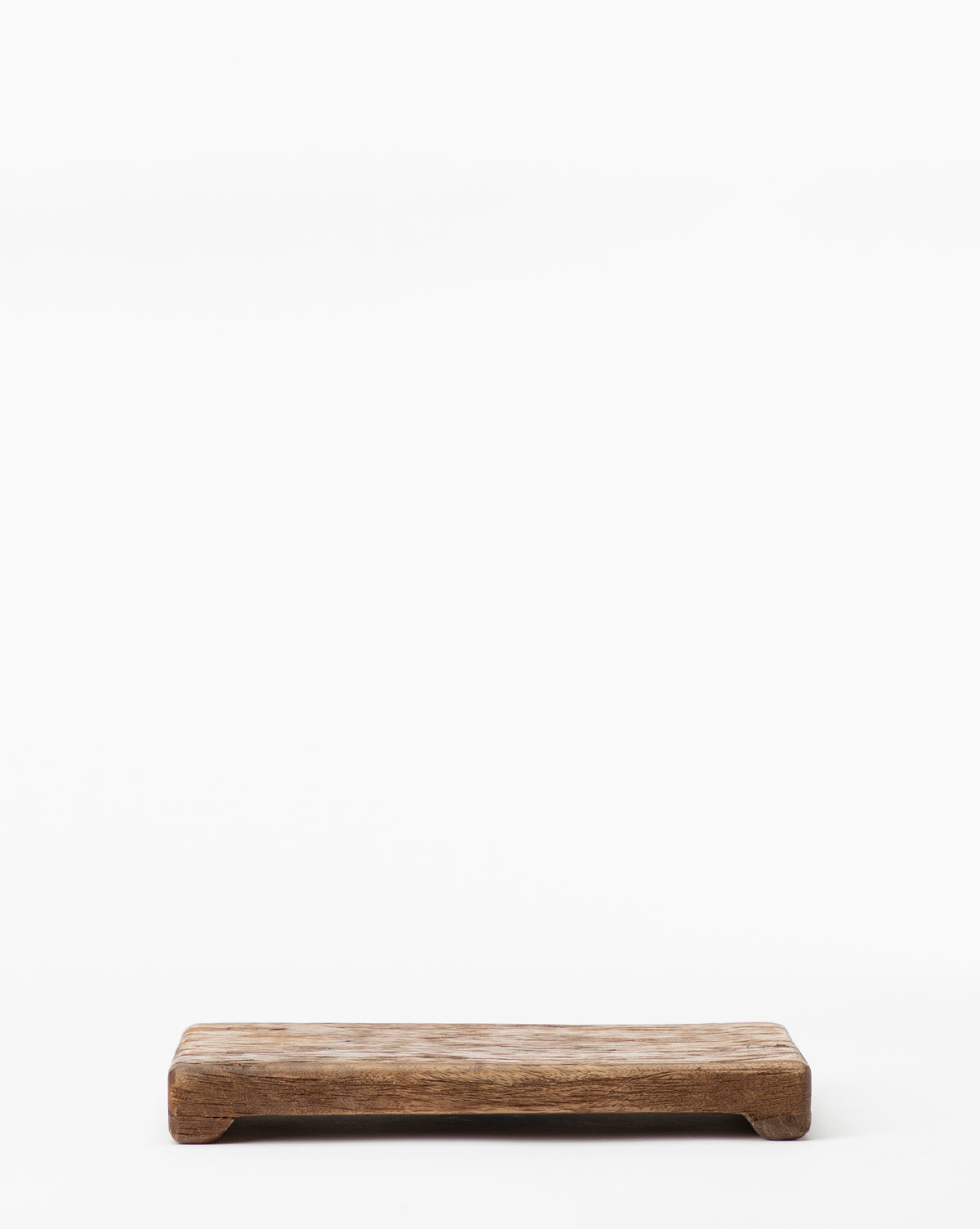 The Mango Wood Rectangular Pedestal is a small piece with a rustic finish, crafted from mango wood and shown on a white background.