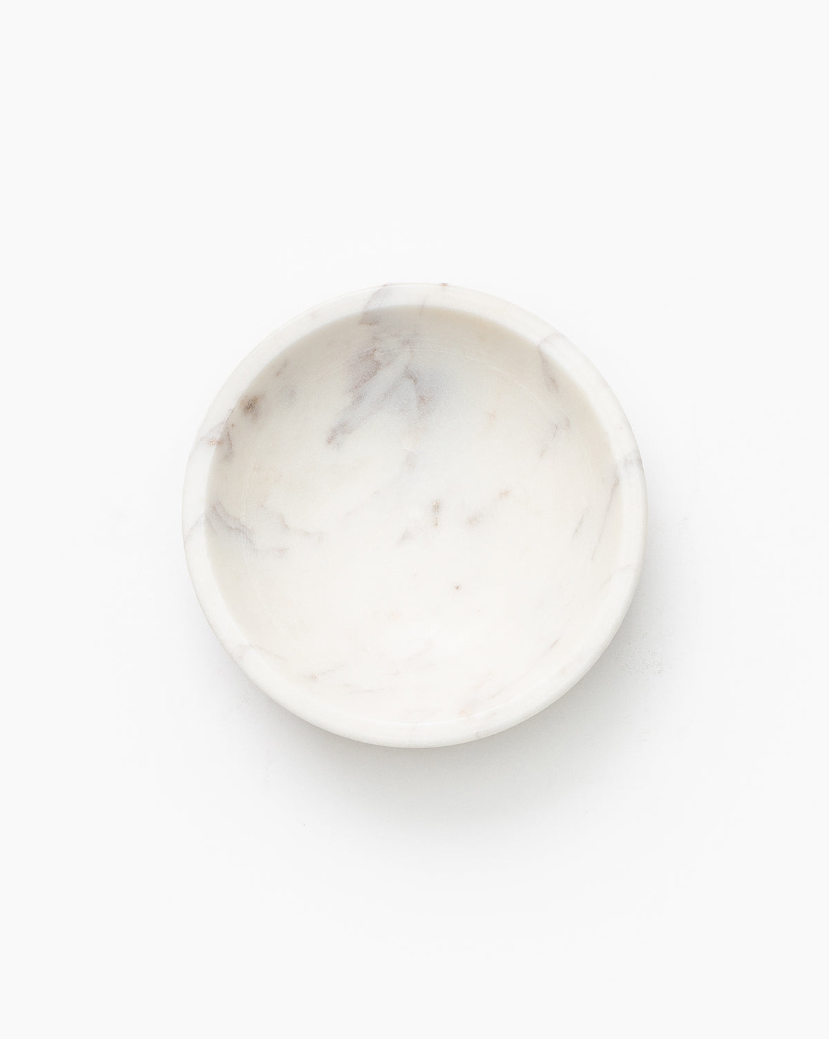 The Marble Nesting Bowls (Set of 3) feature small, round, white marble with subtle gray veins. Ideal for serving or display, these designer bowls are shown against a plain white background.