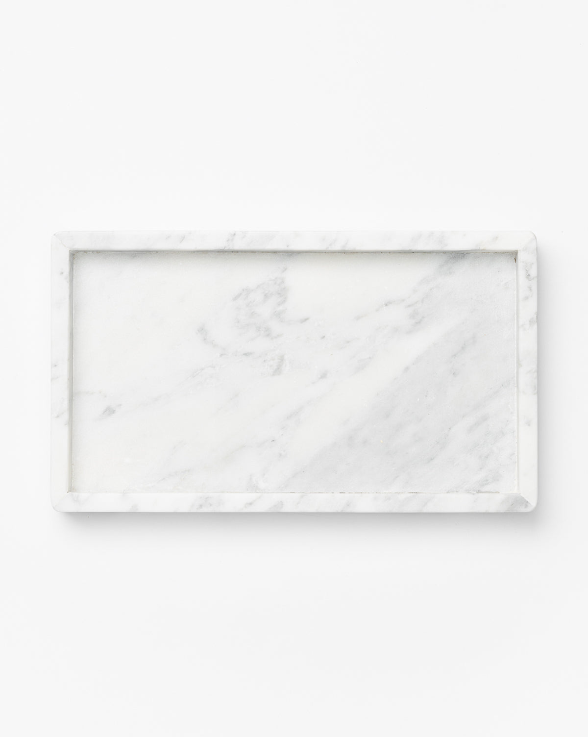 The Marble Tray features a rectangular white design with subtle gray veining, ideal as a countertop tray for decorative vignettes, displayed against a plain white background.
