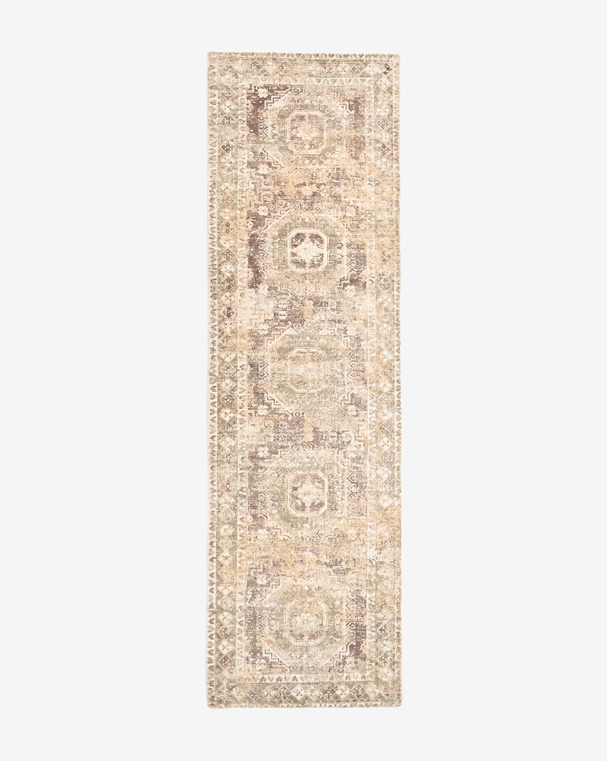 The Marcella Handwoven Rug is a long, narrow, neutral tan wool blend runner featuring a faded geometric pattern and intricate border on a white background, by McGee & Co.