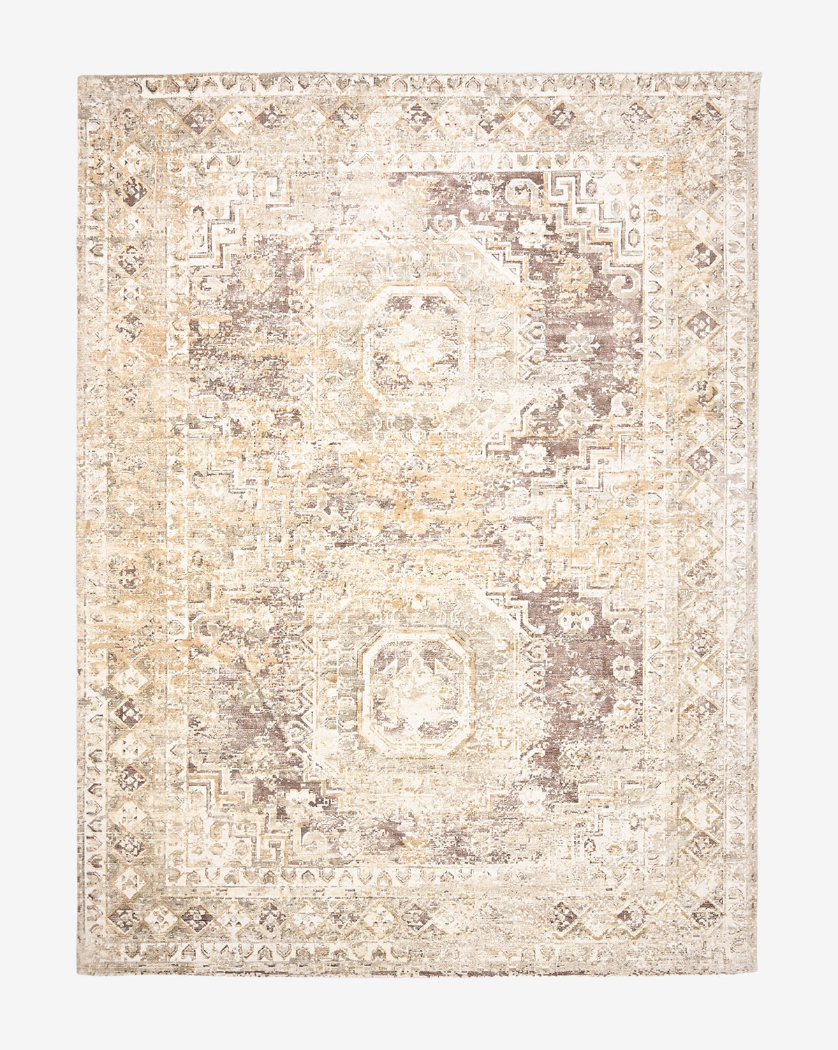 The Marcella Handwoven Rug is a rectangular neutral tan rug with a faded geometric and floral pattern in beige, cream, and light brown, featuring octagonal medallions and a decorative border, by McGee & Co.