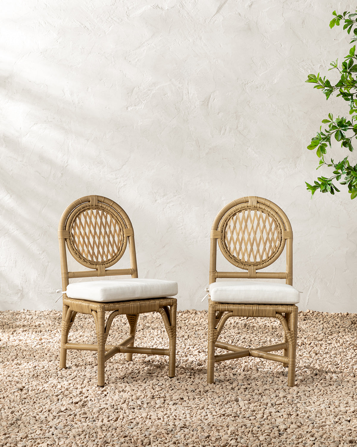 McGee & Co. wicker outdoor dining chairs.