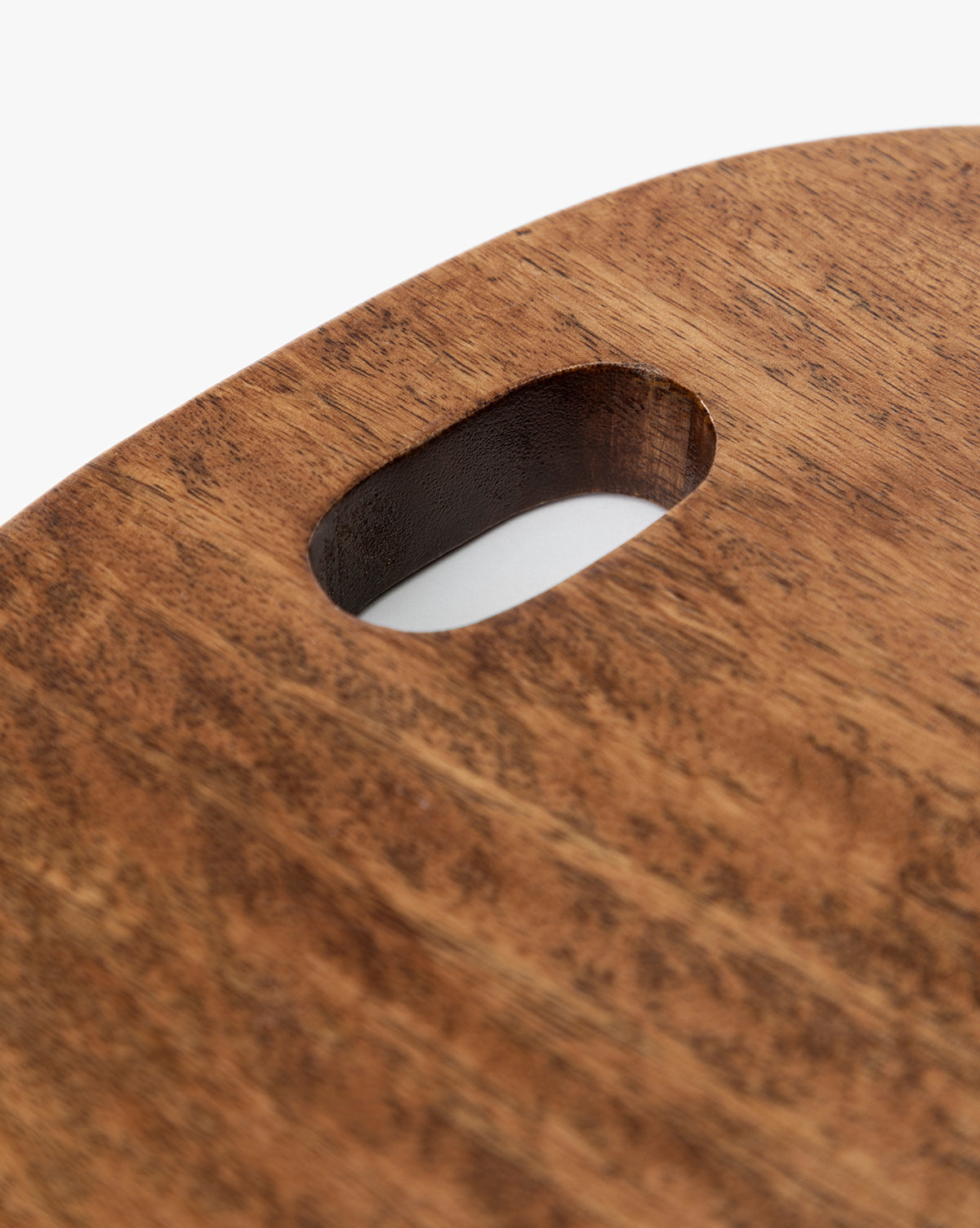 The Marlton Breadboard features a rounded edge and oval handle cutout, crafted from smooth wood with a natural brown finish—adding artisanal charm to any kitchen décor, by McGee & Co.