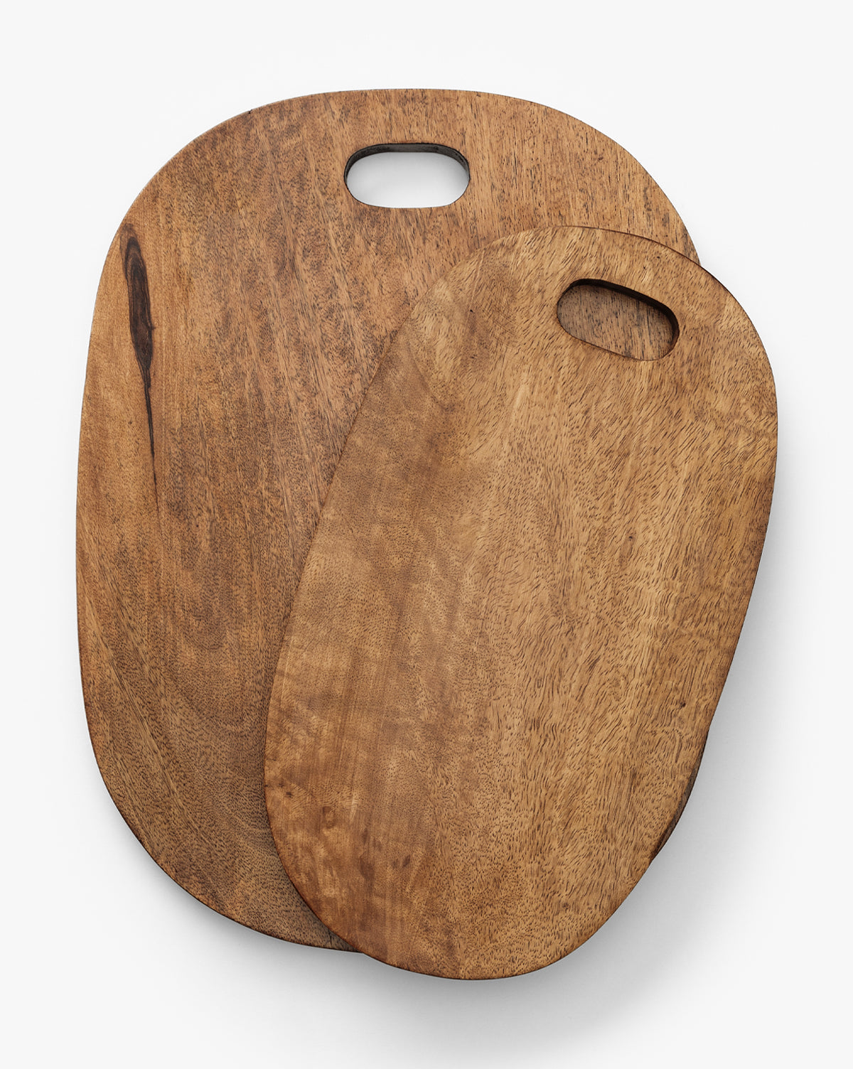 Two Marlton Breadboards with rounded corners and handle holes are stacked against a white background. The smaller board slightly overlaps the larger one, adding a touch of artisanal kitchen decor, by McGee & Co.