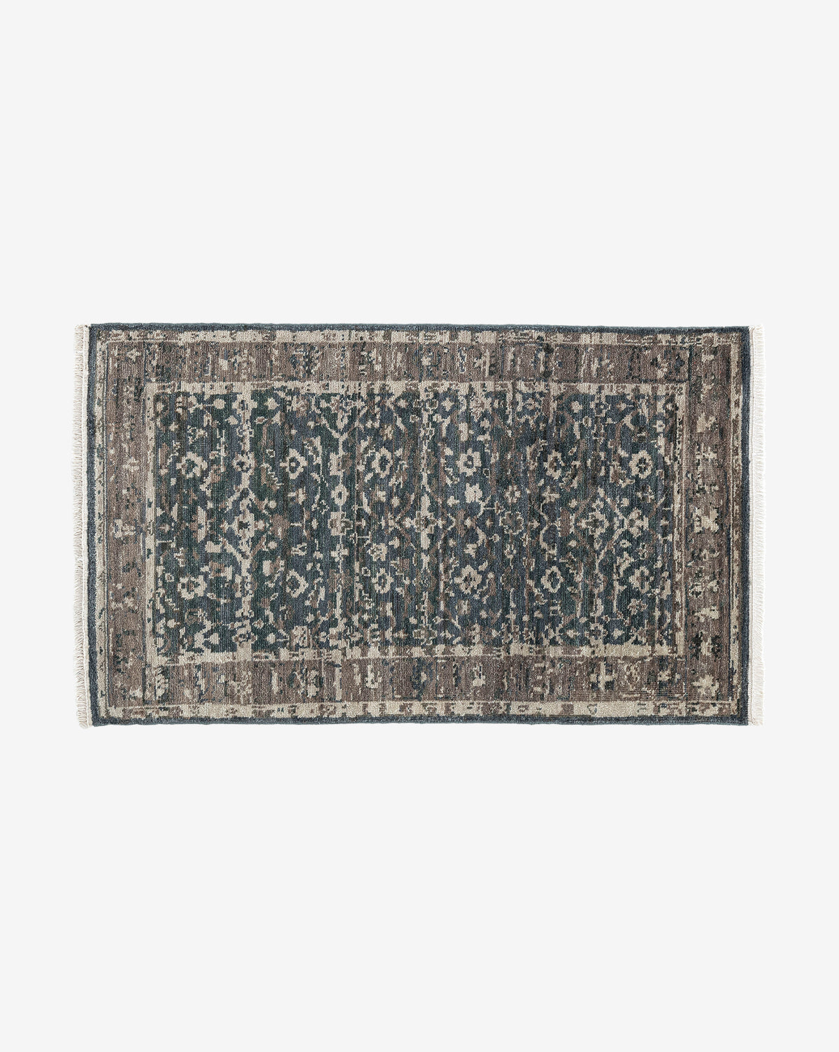 The Marta Hand-Knotted Wool Rug features a rectangular shape, distressed vintage-style pattern in blue, gray, and brown tones with intricate floral and geometric designs plus a decorative border, by McGee & Co.