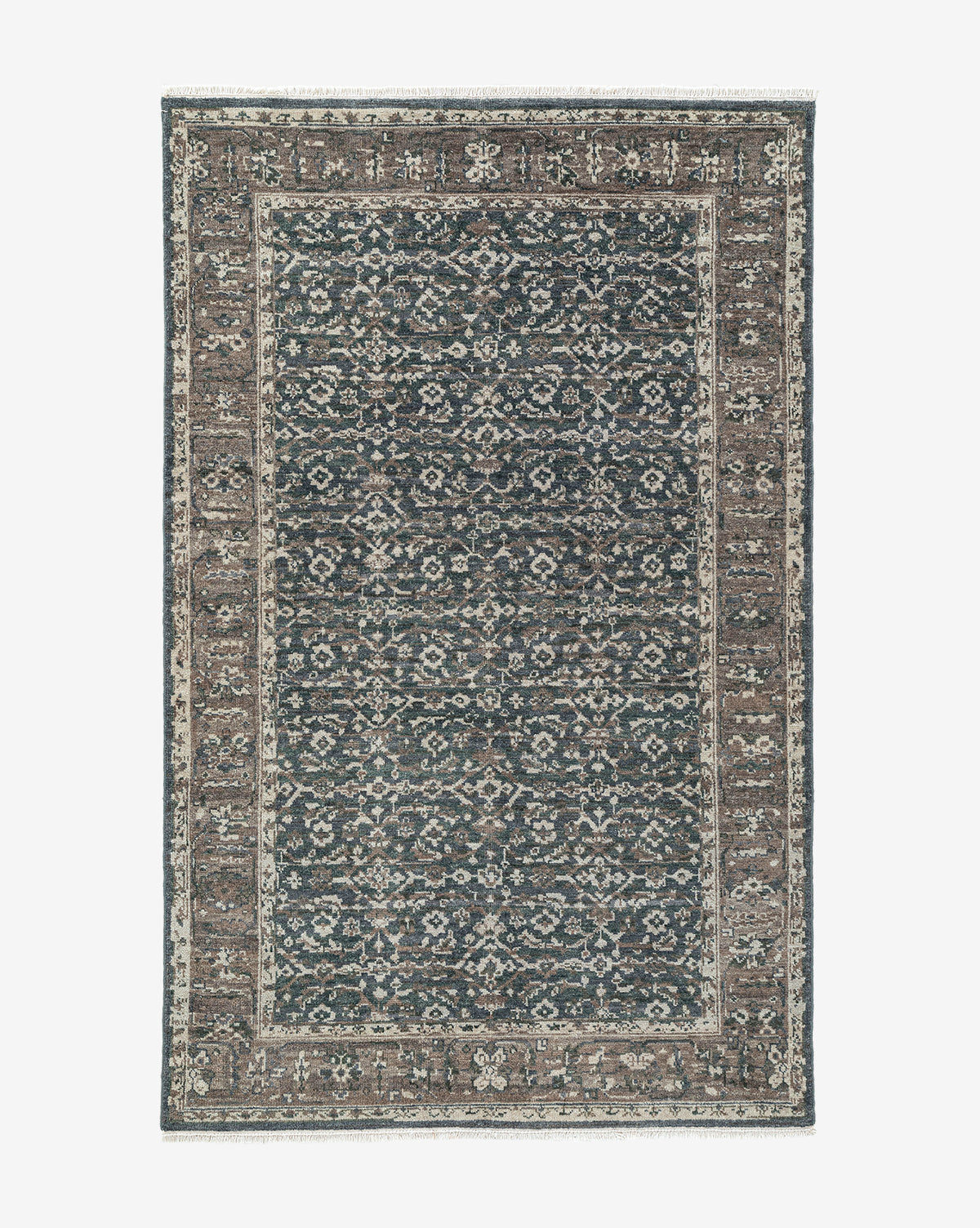 The Marta Hand-Knotted Wool Rug features an intricate floral and geometric design in blue, brown, and beige tones, highlighted by a wide decorative border and a detailed central motif, by McGee & Co.
