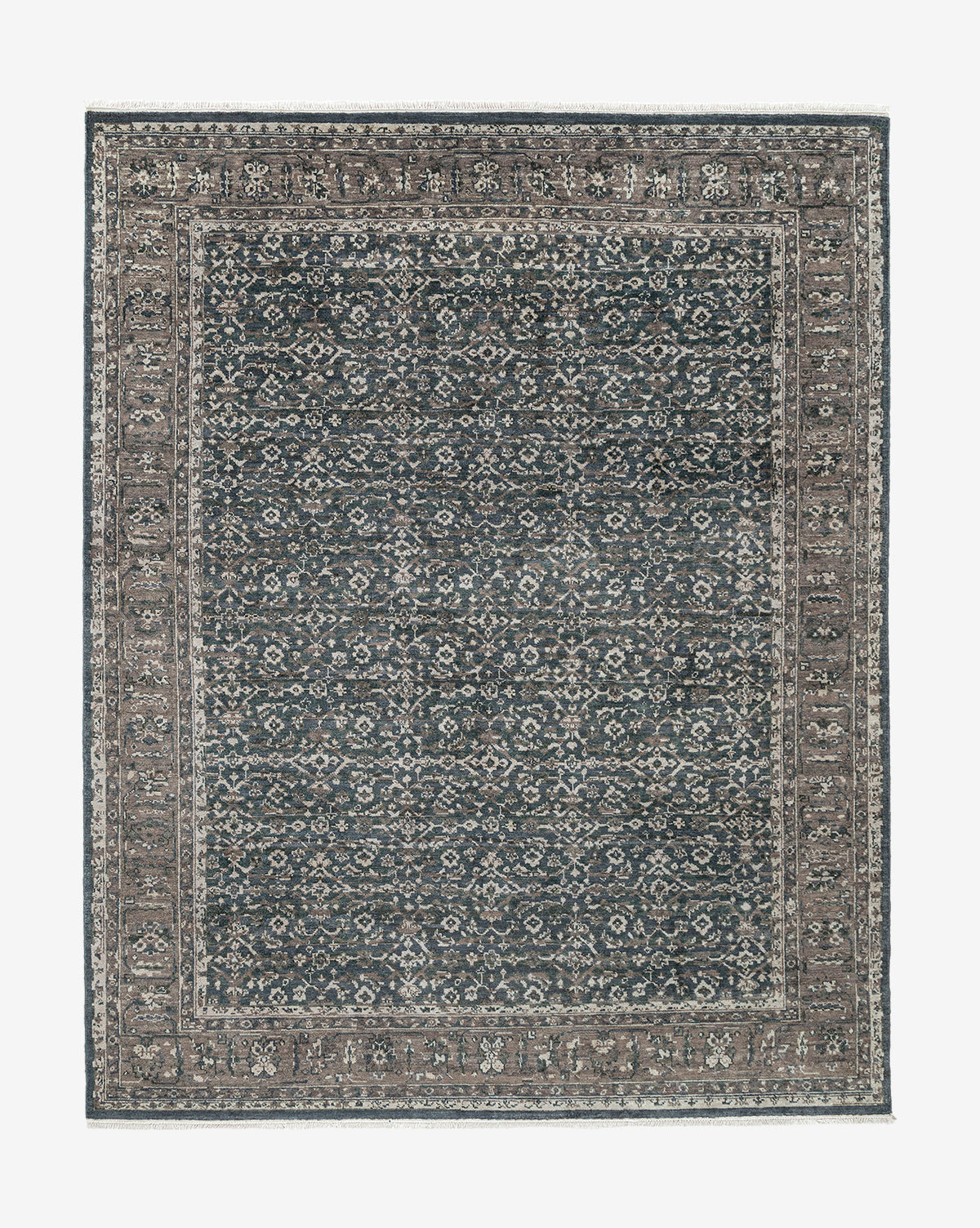 The Marta Hand-Knotted Wool Rug features an intricate geometric and floral pattern in gray and beige, complemented by a detailed border around the central design, by McGee & Co.