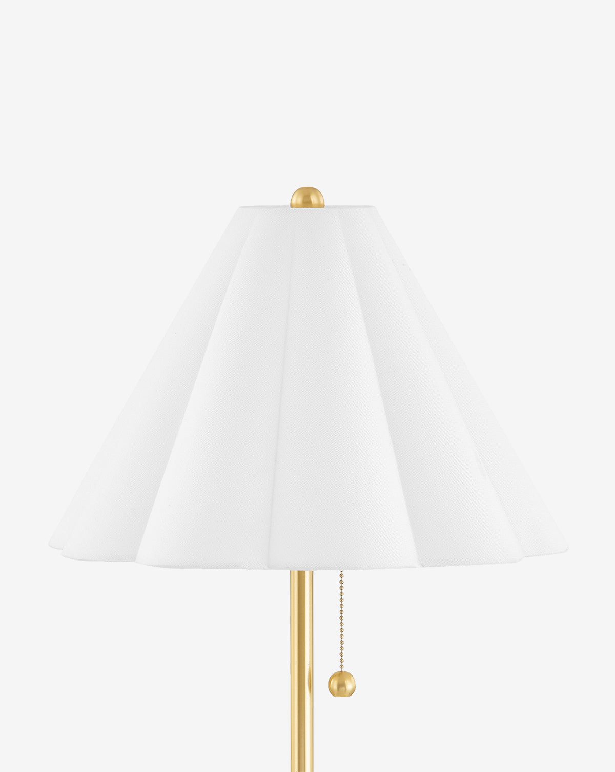 The Martha Table Lamp, with an aged brass finish and pleated Belgian linen shade, features a pull chain switch and is shown against a white background by McGee & Co.