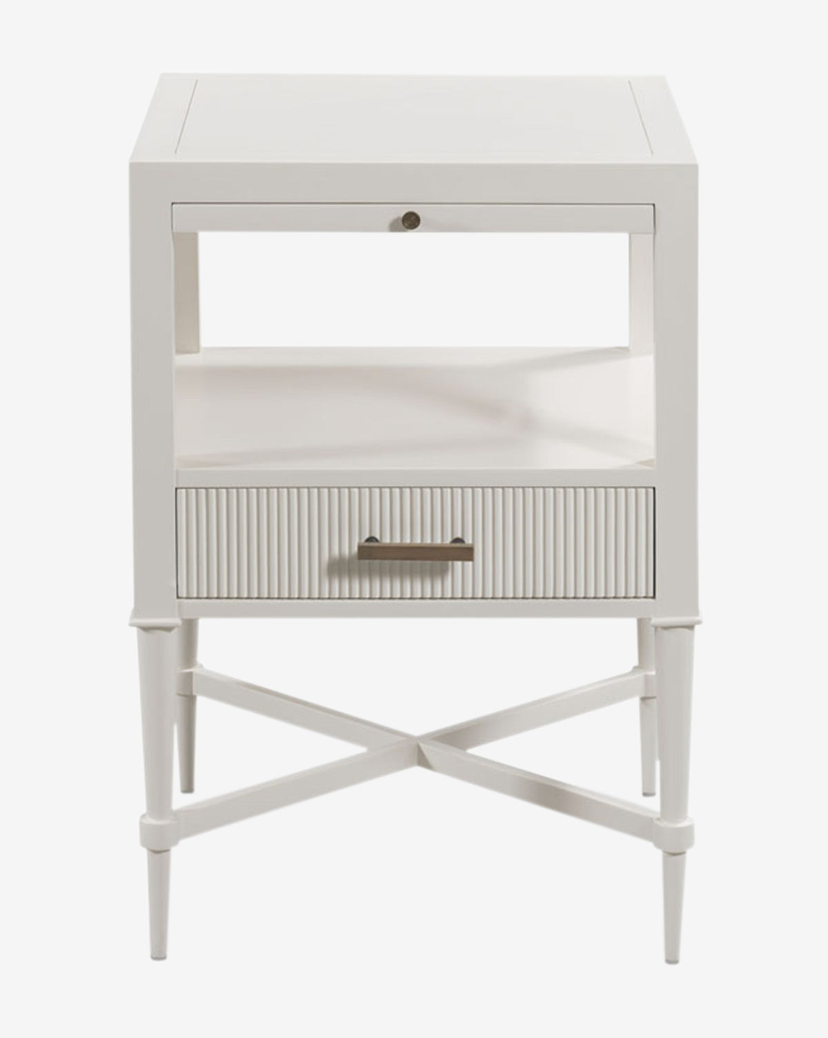 The Martinez Nightstand showcases a white wooden finish, reeded drawer front with brass hardware, an open shelf, and tapered legs with crossbars, all presented against a white background by McGee & Co.