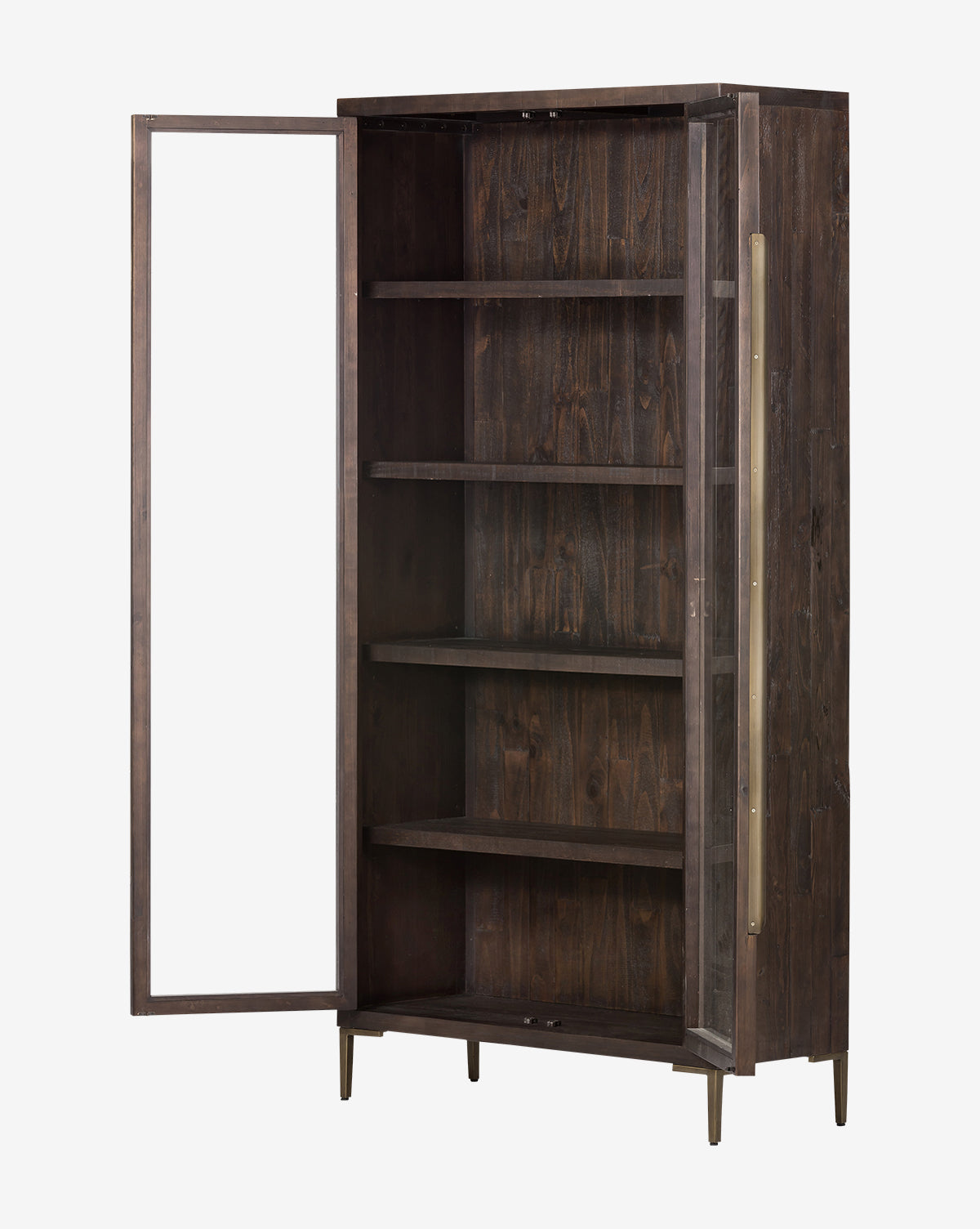 The Maverick Cabinet is a tall, dark reclaimed pine cabinet with four shelves, iron hardware, a left-hinged glass door, long brass handle, minimalist modern design, and sturdy brass legs, by McGee & Co.
