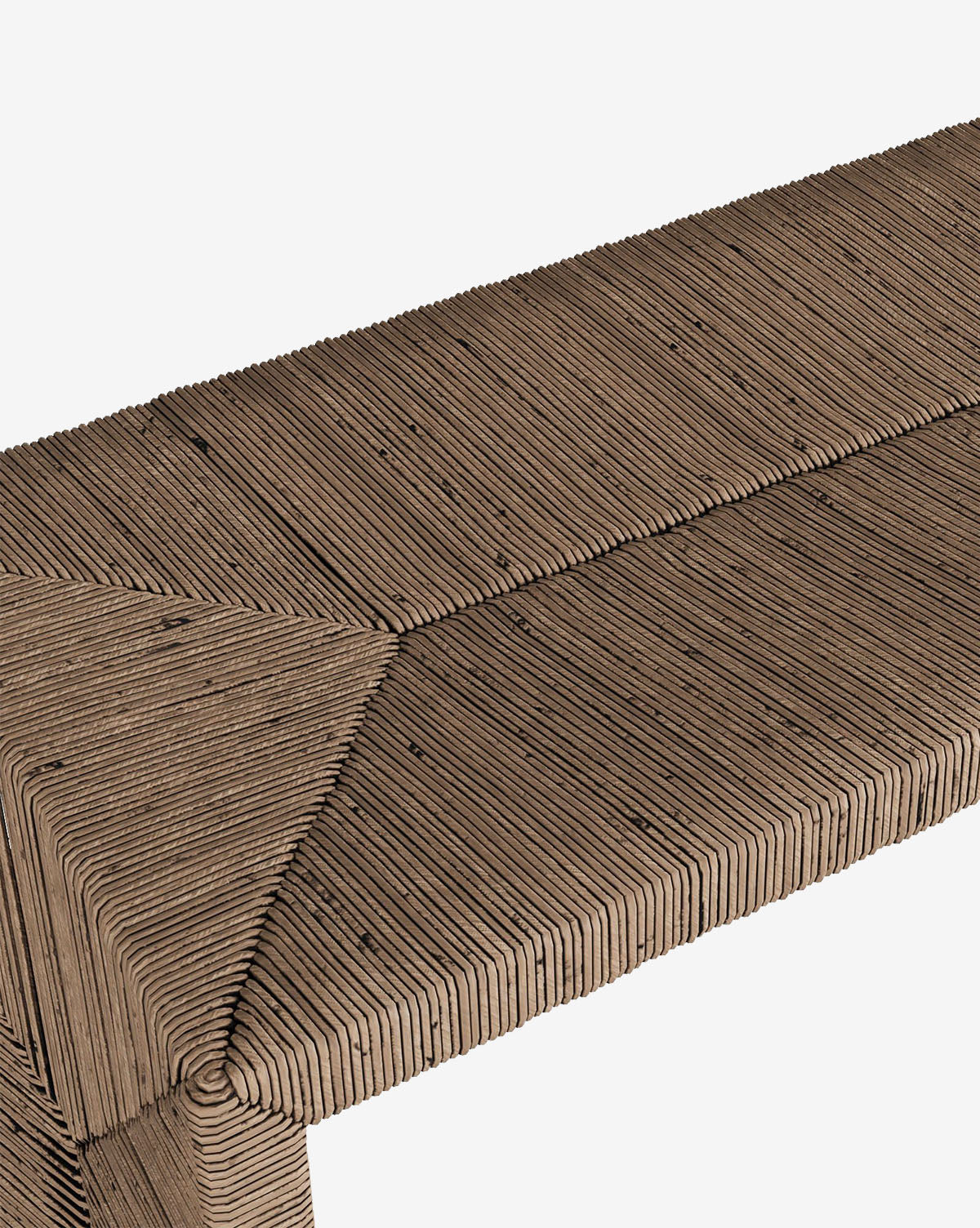 Close-up of the McCarthy Bench entryway seating, crafted from tightly packed, vertically arranged cardboard strips with visible layered textures, forming a seat and triangular-patterned corner on a white background, by McGee & Co.