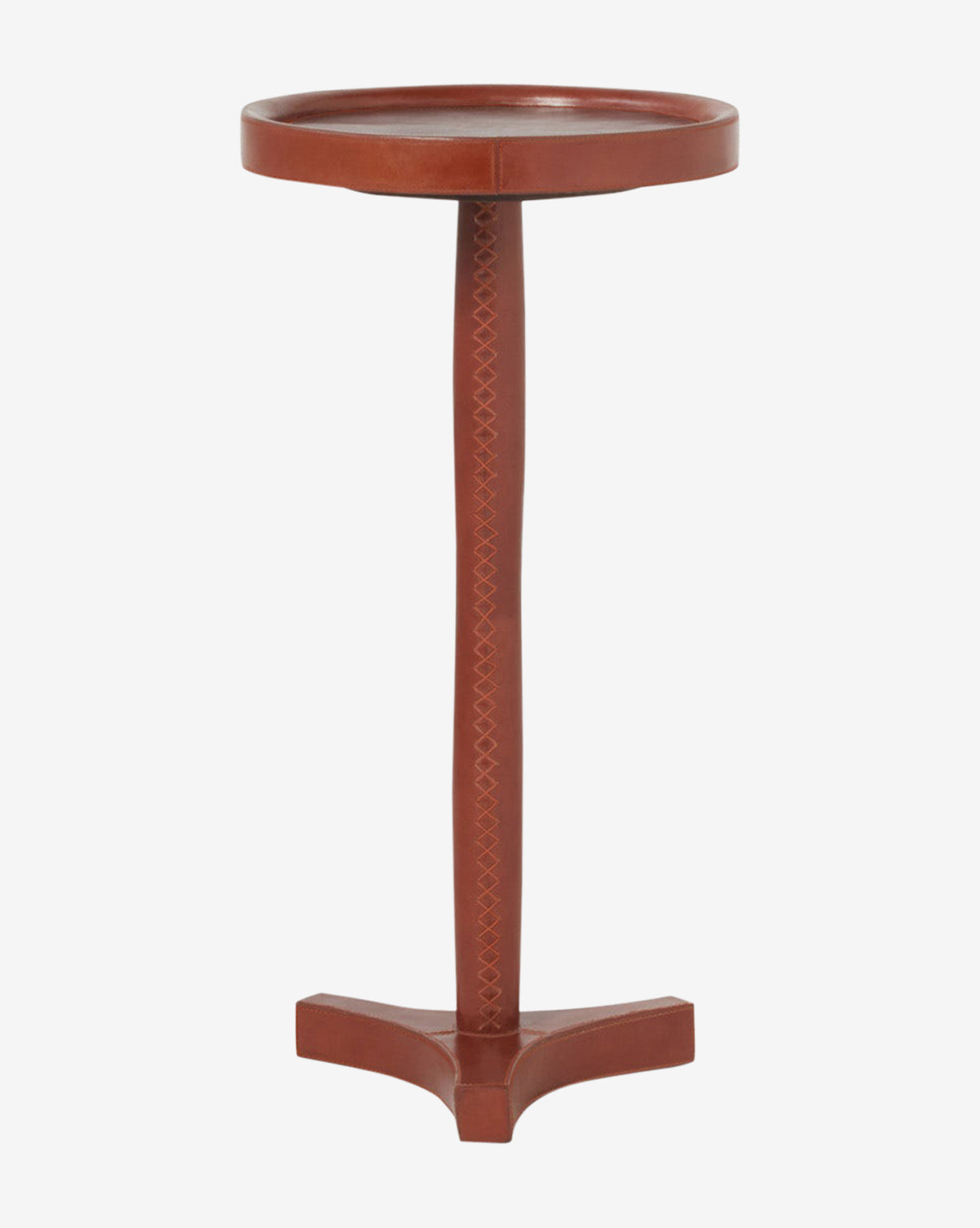 The McCoy Leather Side Table is tall and narrow with a round top, reddish-brown leather, a single central leg with a crisscross pattern, and a three-pointed base by McGee & Co.