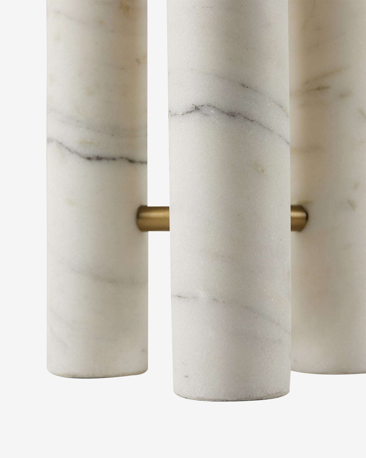 Close-up of three solid marble rods with subtle grey veining, mounted vertically on a brass rod against a white background—a refined decorative accent from the Medici Table Lamp, by McGee & Co.