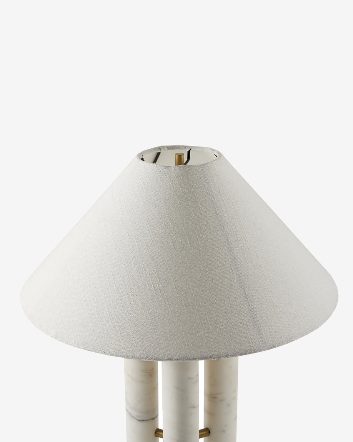 A close-up of the Medici Table Lamp shows its white cone-shaped linen shade and solid marble base against a plain white background, by McGee & Co.