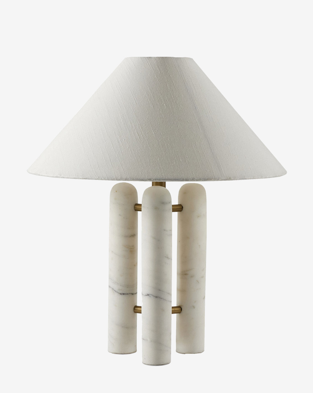 The Medici Table Lamp showcases a decorative design with a white, cone-shaped fabric shade and a base made of solid marble columns linked by brass rods, by McGee & Co.