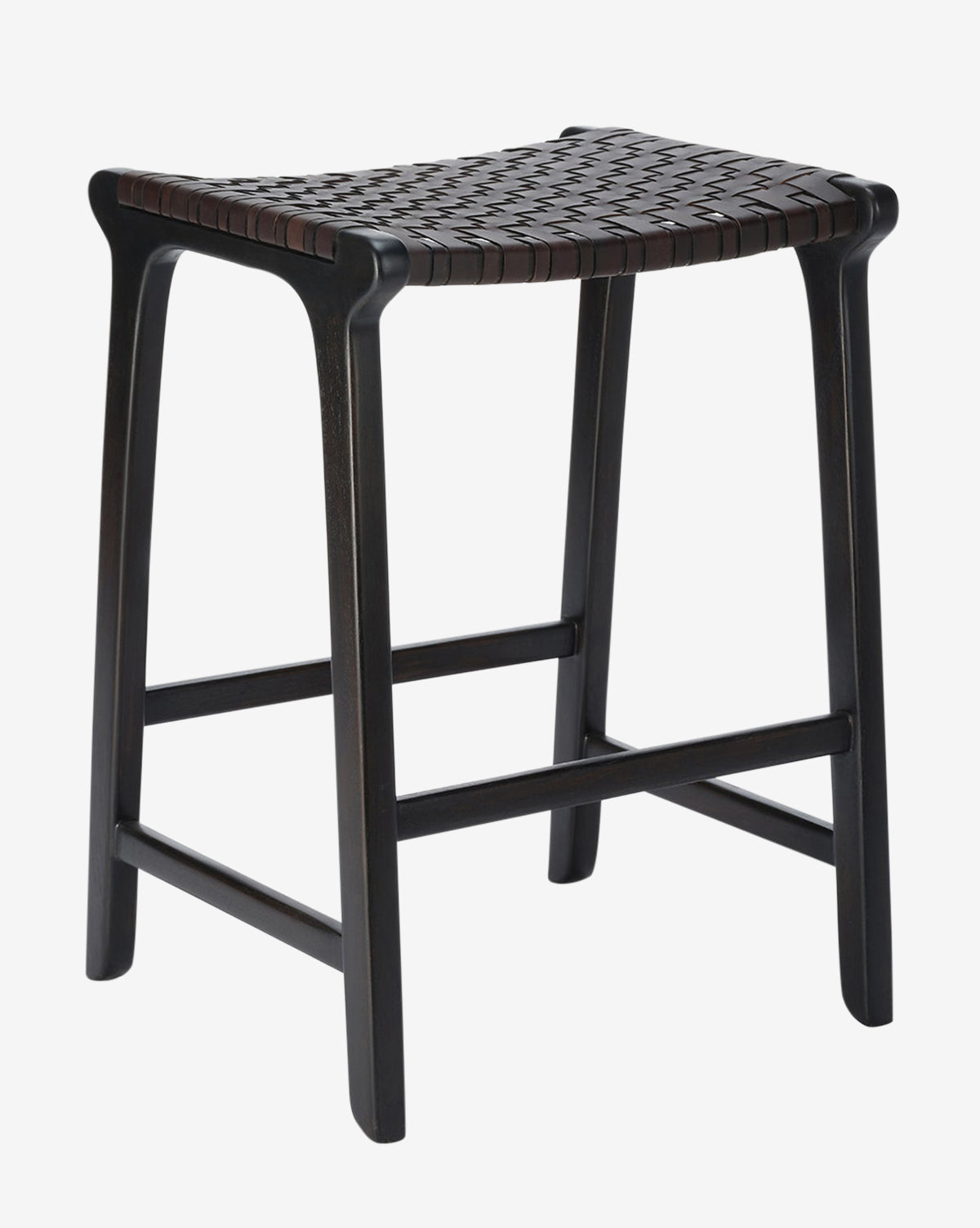 The Meliora Counter Stool by Made Goods features a dark teak frame, four sturdy legs, a footrest, and a woven leather seat with a gently curved design for comfort. McGee & Co.