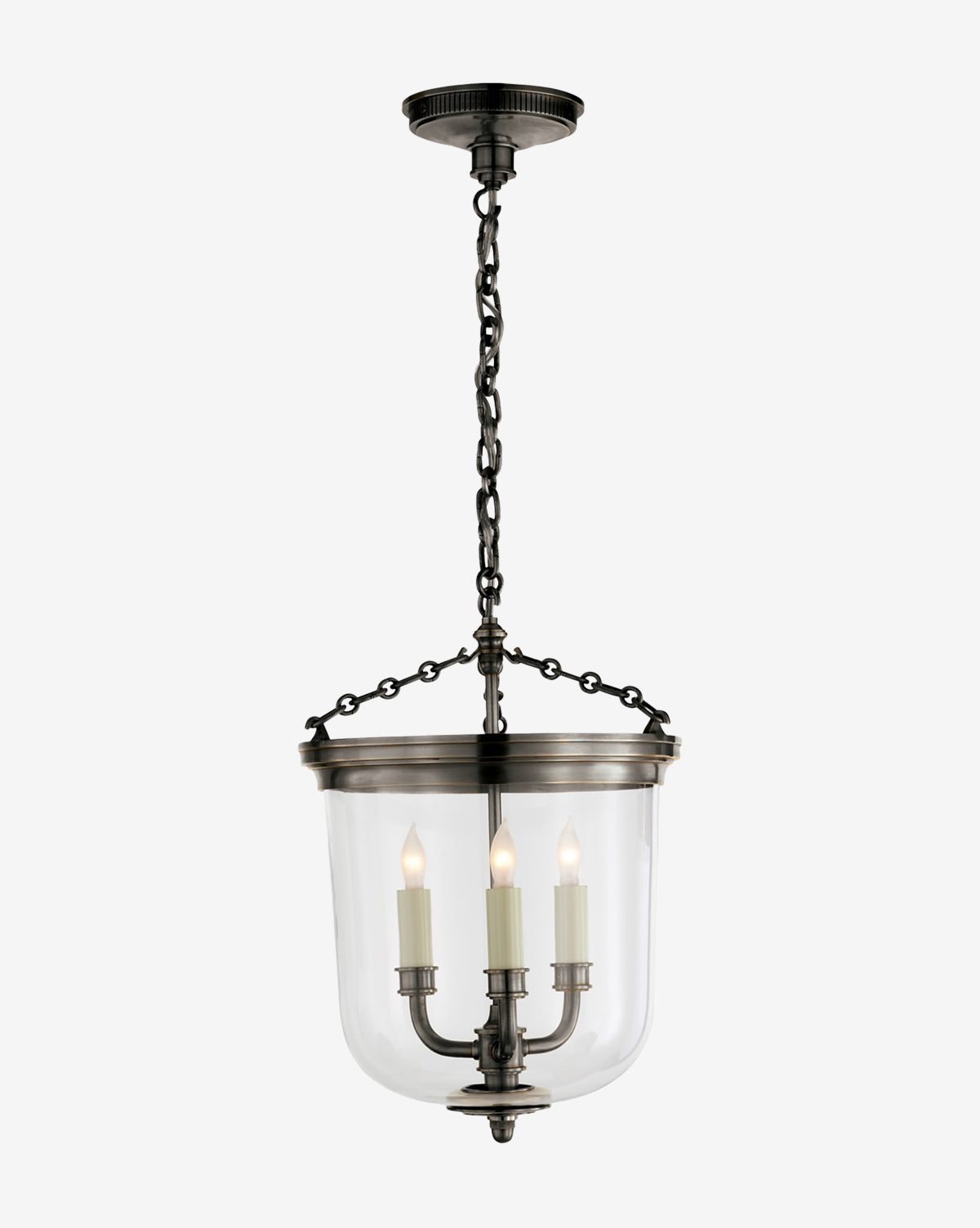 The Merchant Lantern is a black metal pendant with a glass dome shade hanging from a chain, featuring three candle-style bulbs arranged in a triangle for sophisticated and elegant lighting, by McGee & Co.