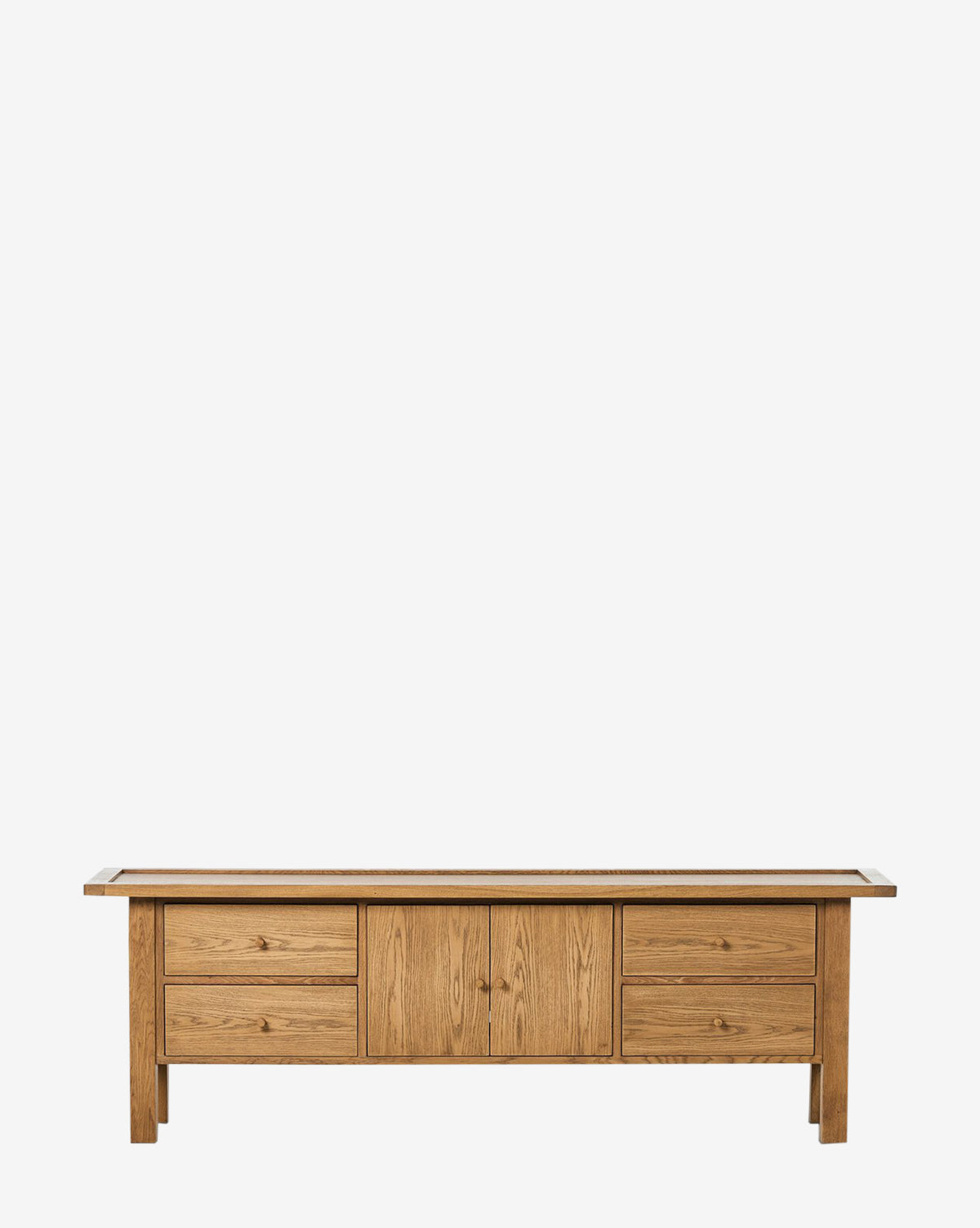 The Mireille Console is a wooden oak sideboard with four drawers and two central cabinet doors, featuring a modern design and natural finish—ideal for entryway storage—shown against a plain white background, by McGee & Co.