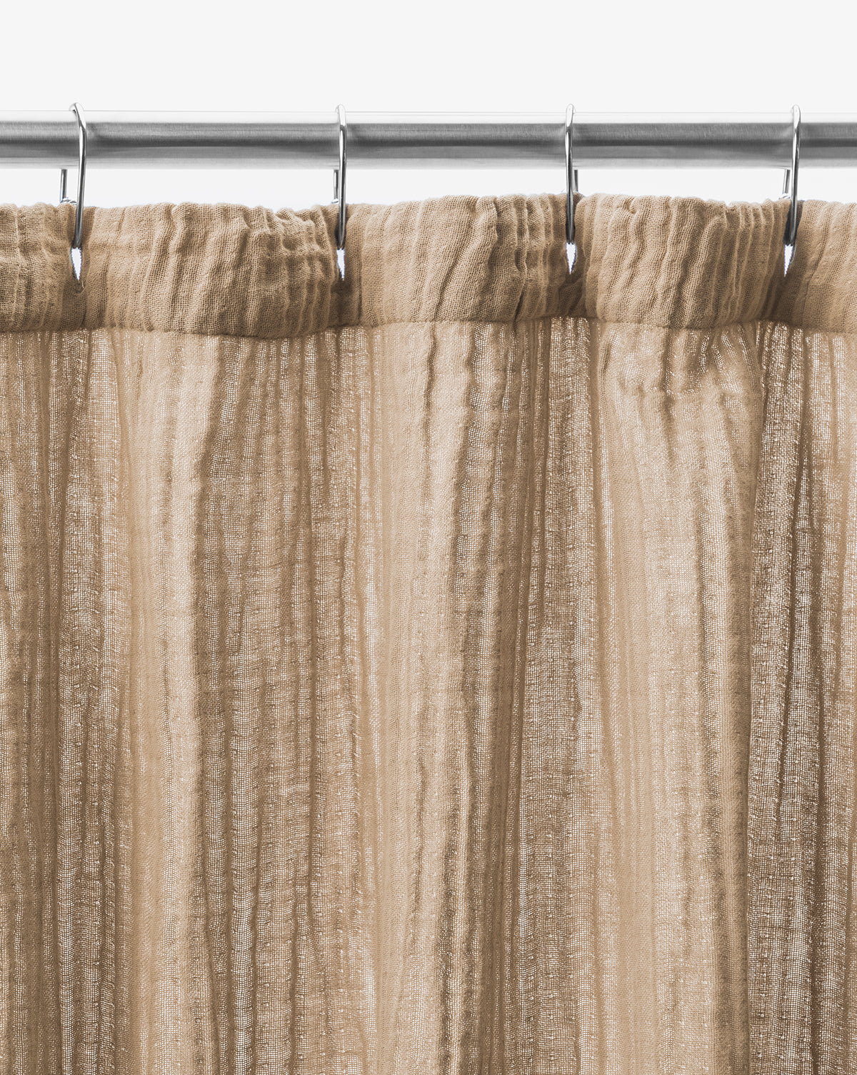 The Mirella Shower Curtain, in light brown double-layer sheer fabric with vertical textured lines, hangs from a silver rod with hooks. Shown close-up against a white background, its semi-transparent design adds an elegant touch.