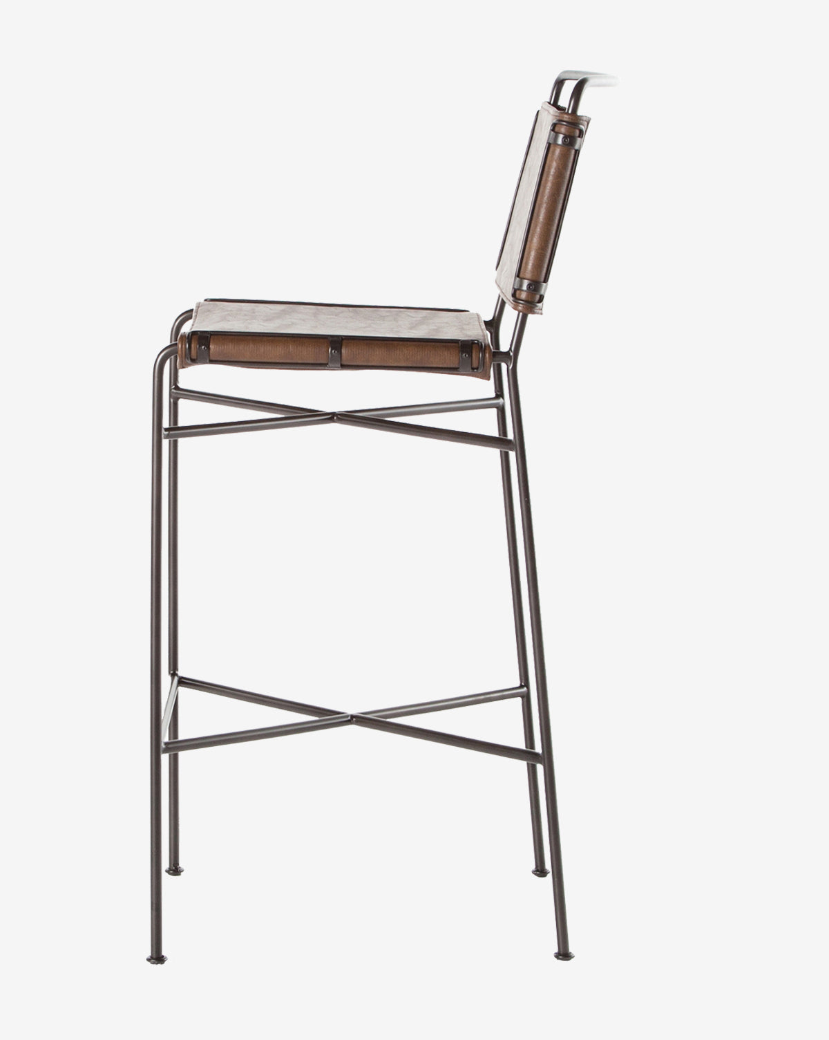 Side view of the Moore Stool, showcasing a brown leather seat and backrest on a sleek metal frame with slim legs, crossbar support, and minimalist industrial style, by McGee & Co.
