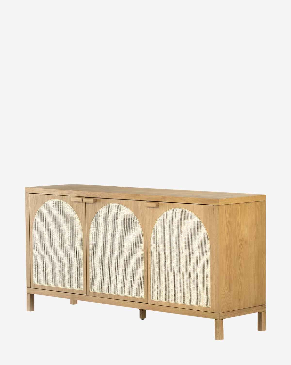 The Mora Sideboard is a honey oak mid-century piece with three doors, each adorned with arch-shaped woven rattan caning, shown against a plain white background by McGee & Co.