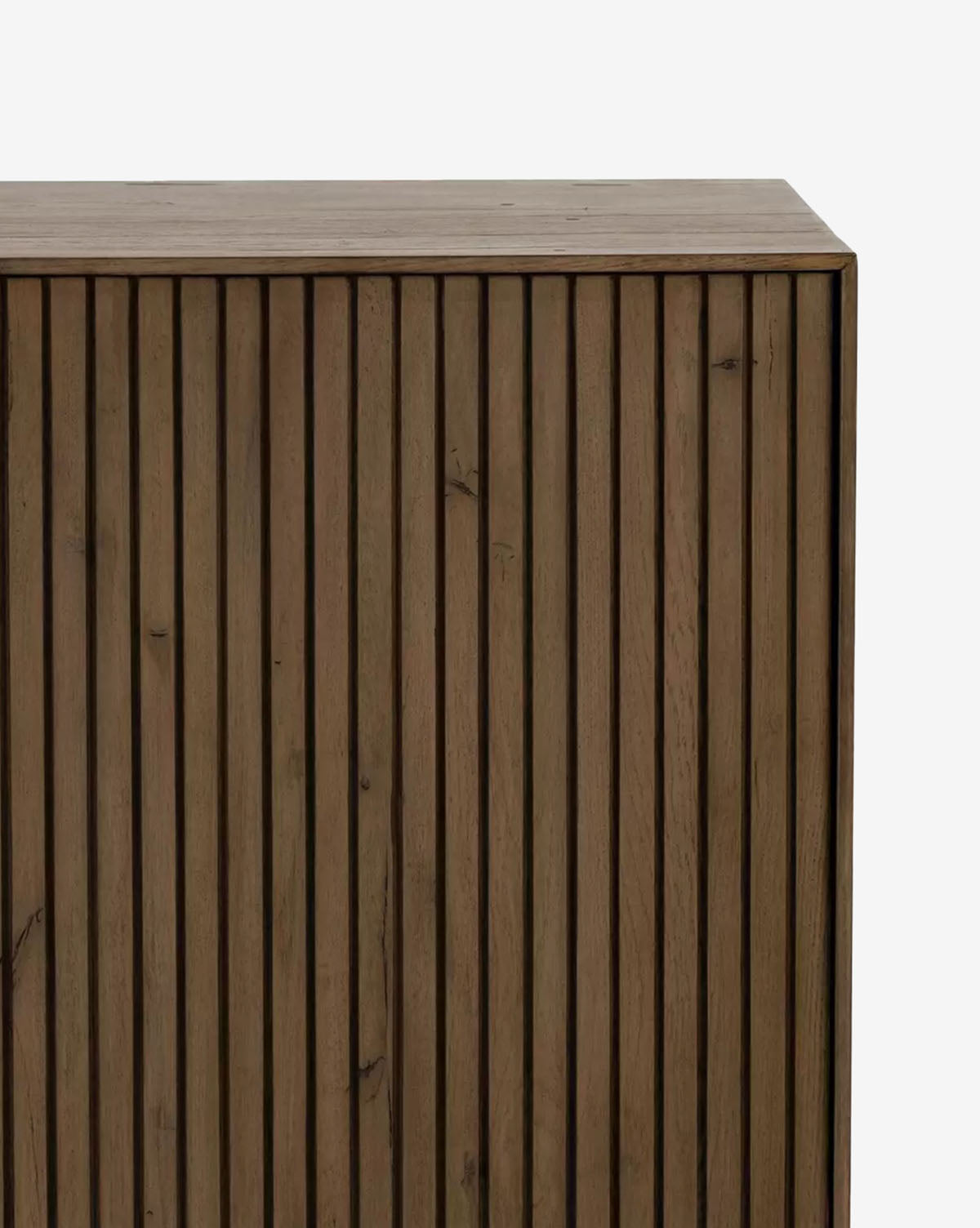 A close-up of the Murron Sideboard—a rectangular piece featuring fluted door fronts, a natural brown wood finish, and a simple modern design—displayed against a plain white background by McGee & Co.